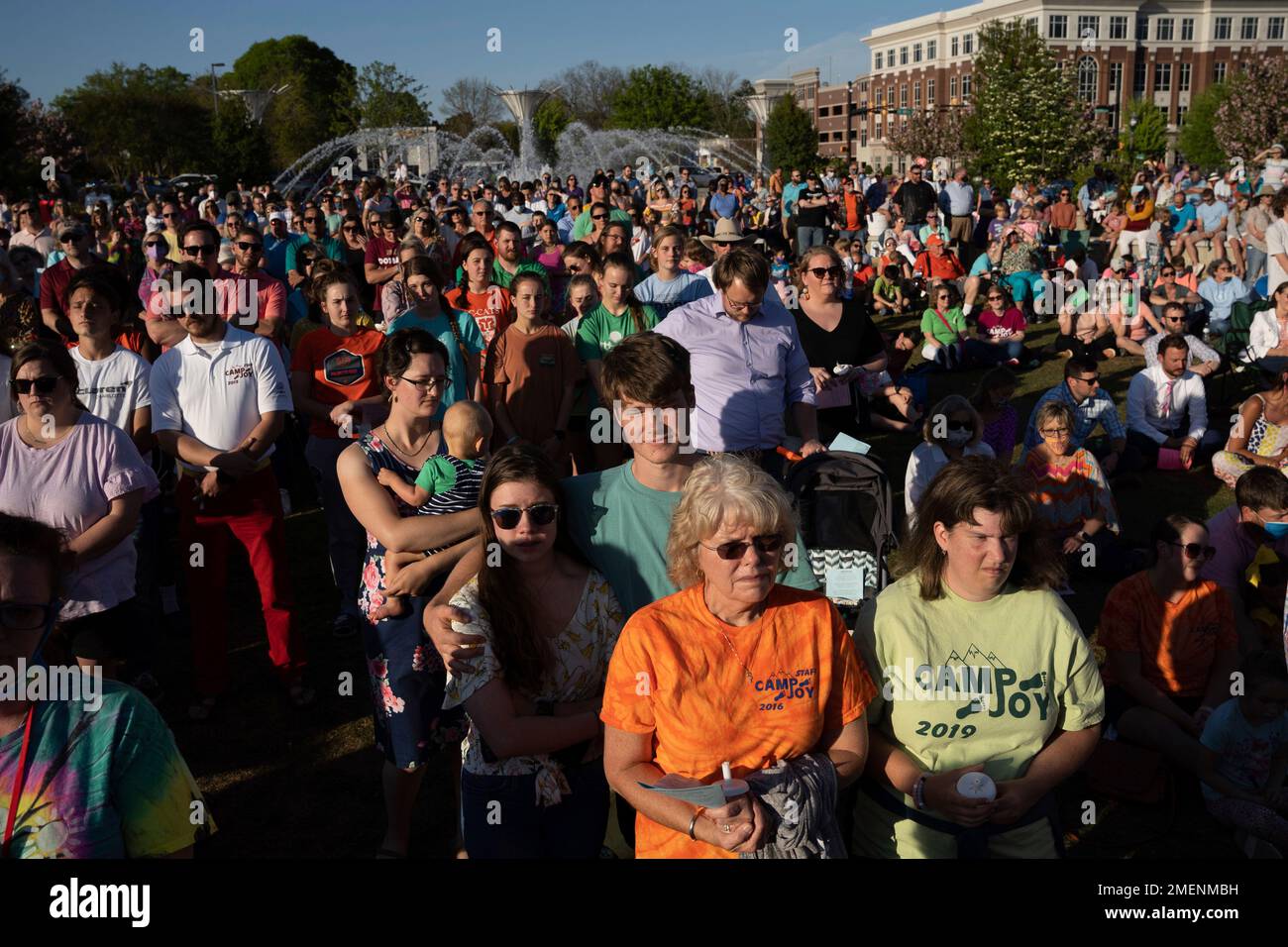 People participate in a memorial service and prayer vigil for the