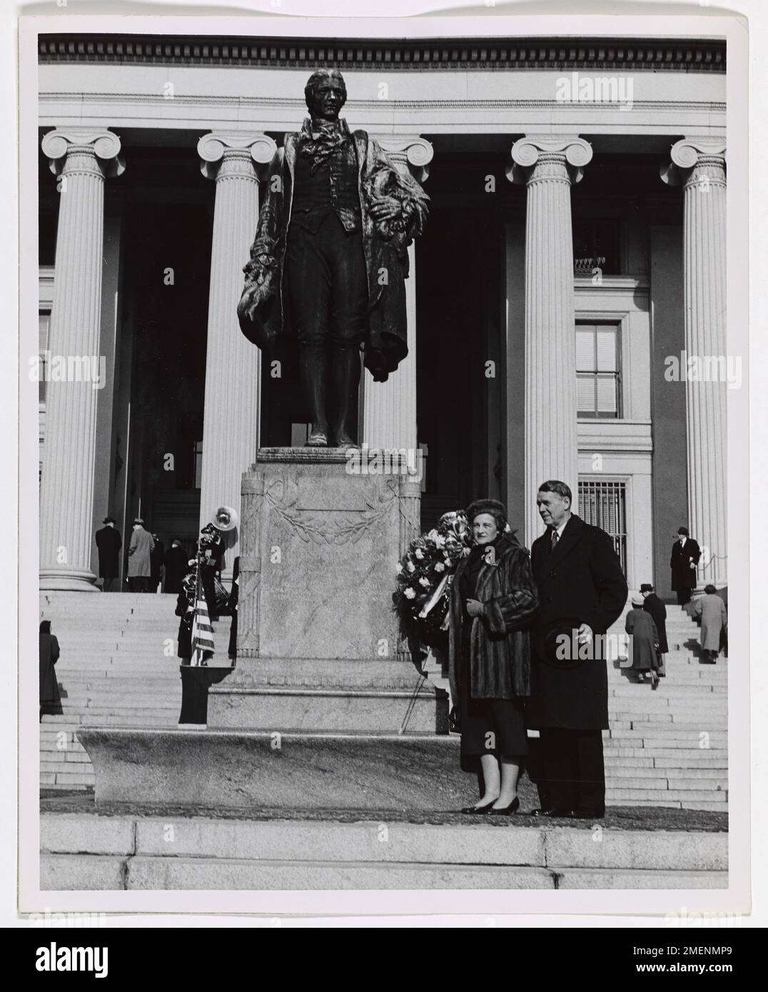 Photograph of a Man and Woman Standing in Front of Alexander Hamilton Statue. Stock Photo