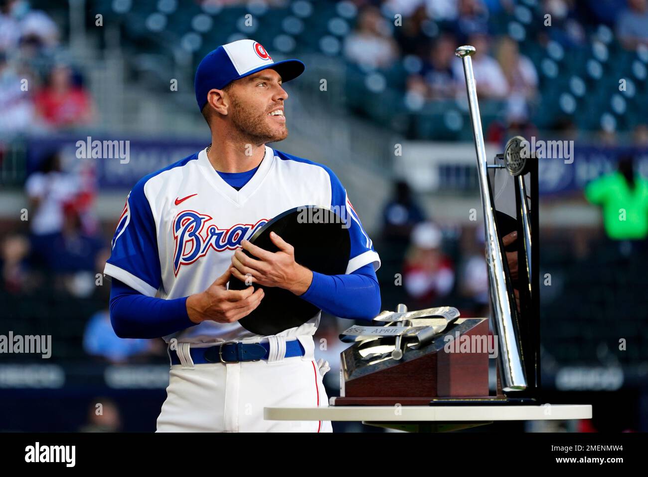 Atlanta Braves first baseman Freddie Freeman (5) holds the National League  Most Valuable Player award during a ceremony before a baseball game against  the Philadelphia Phillies Sunday, April 11, 2021, in Atlanta. (
