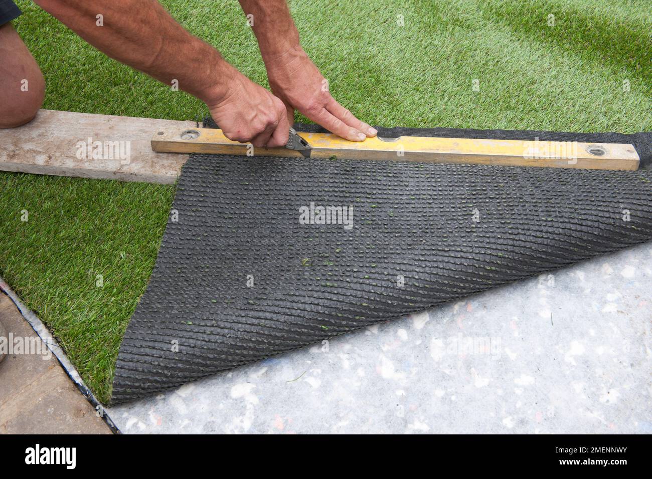 Removing the grassfree border from the edge of a sheet of artificial