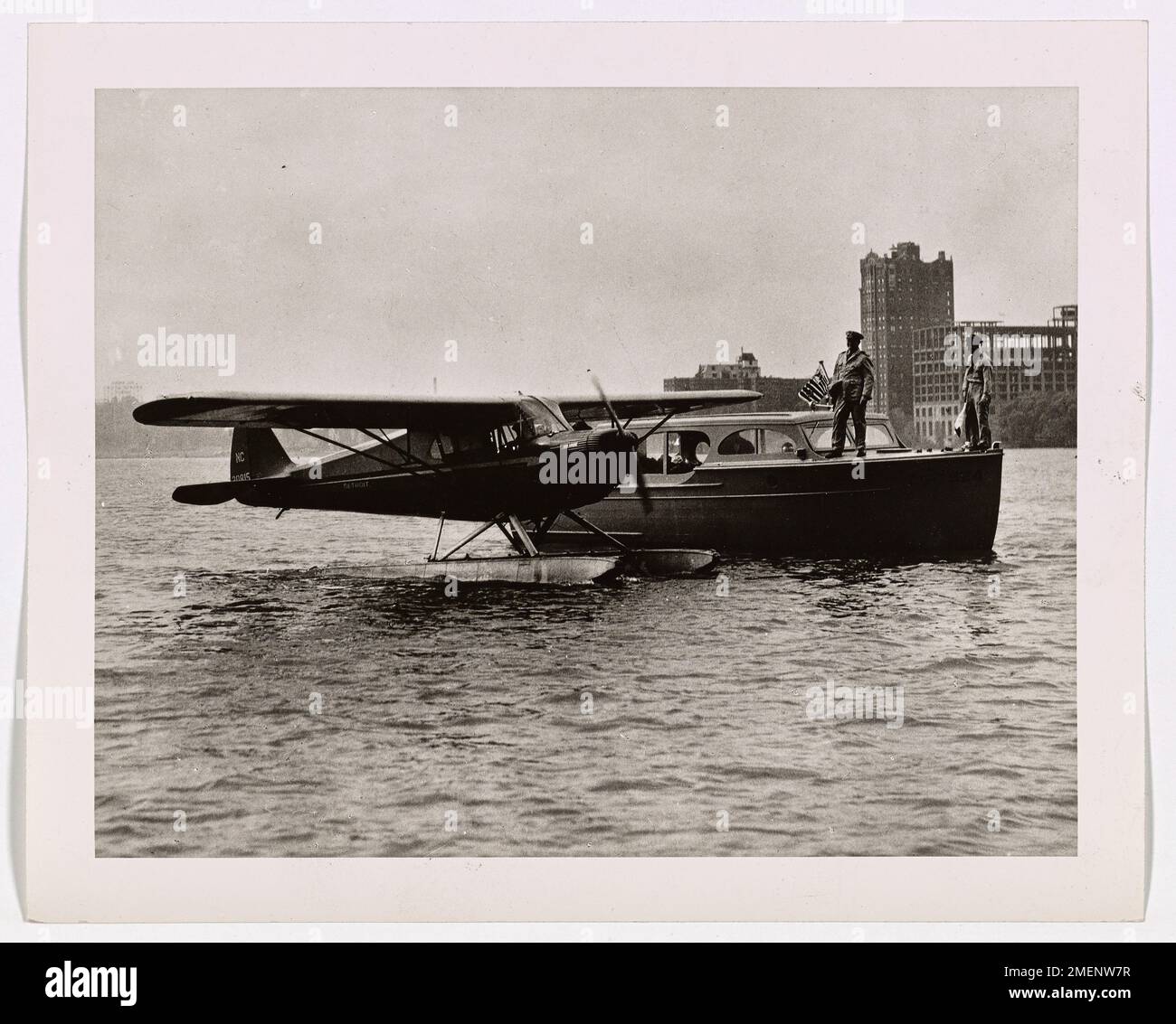 A Coast Guard Reserve vessel and a seaplane are shown operating ...