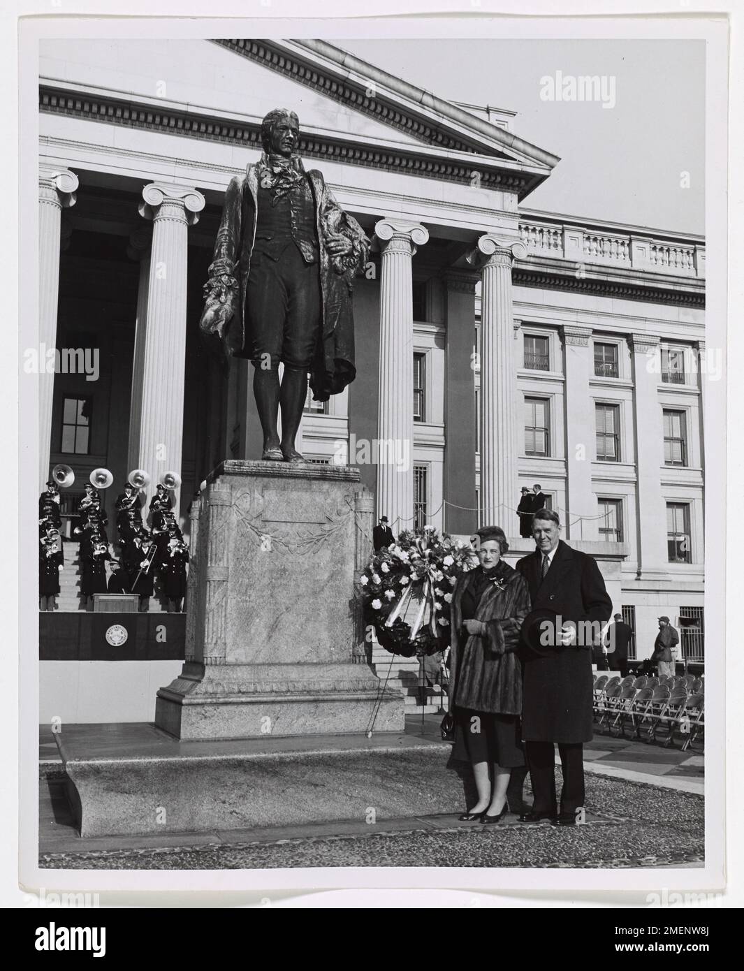 Photograph of a Man and Woman Standing in Front of Alexander Hamilton Statue. Stock Photo