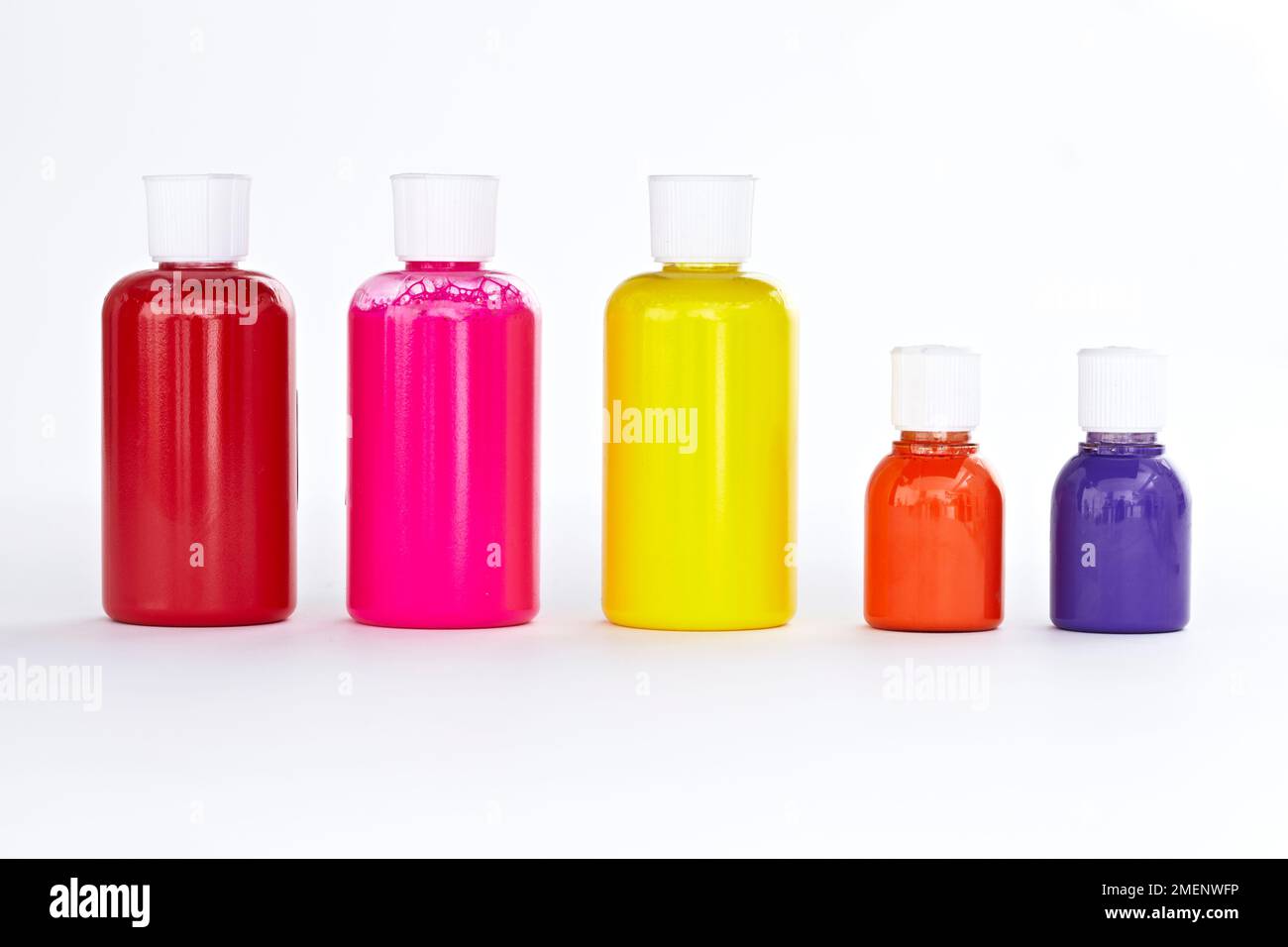 Five clear plastic bottles containing silk paints Stock Photo Alamy
