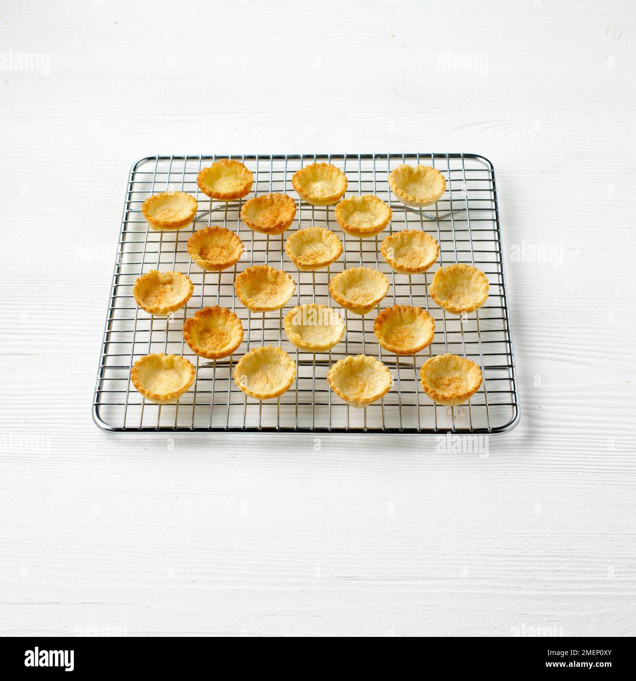 Baked bread croustade cases on cooling rack Stock Photo Alamy
