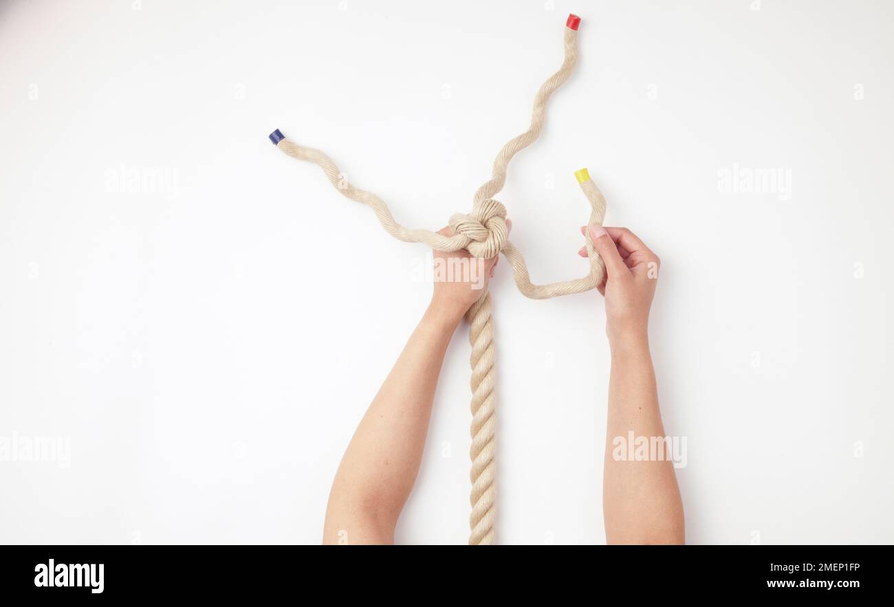 Diamond Knot - Step 1, tying a crown knot (stopper knot) Stock Photo