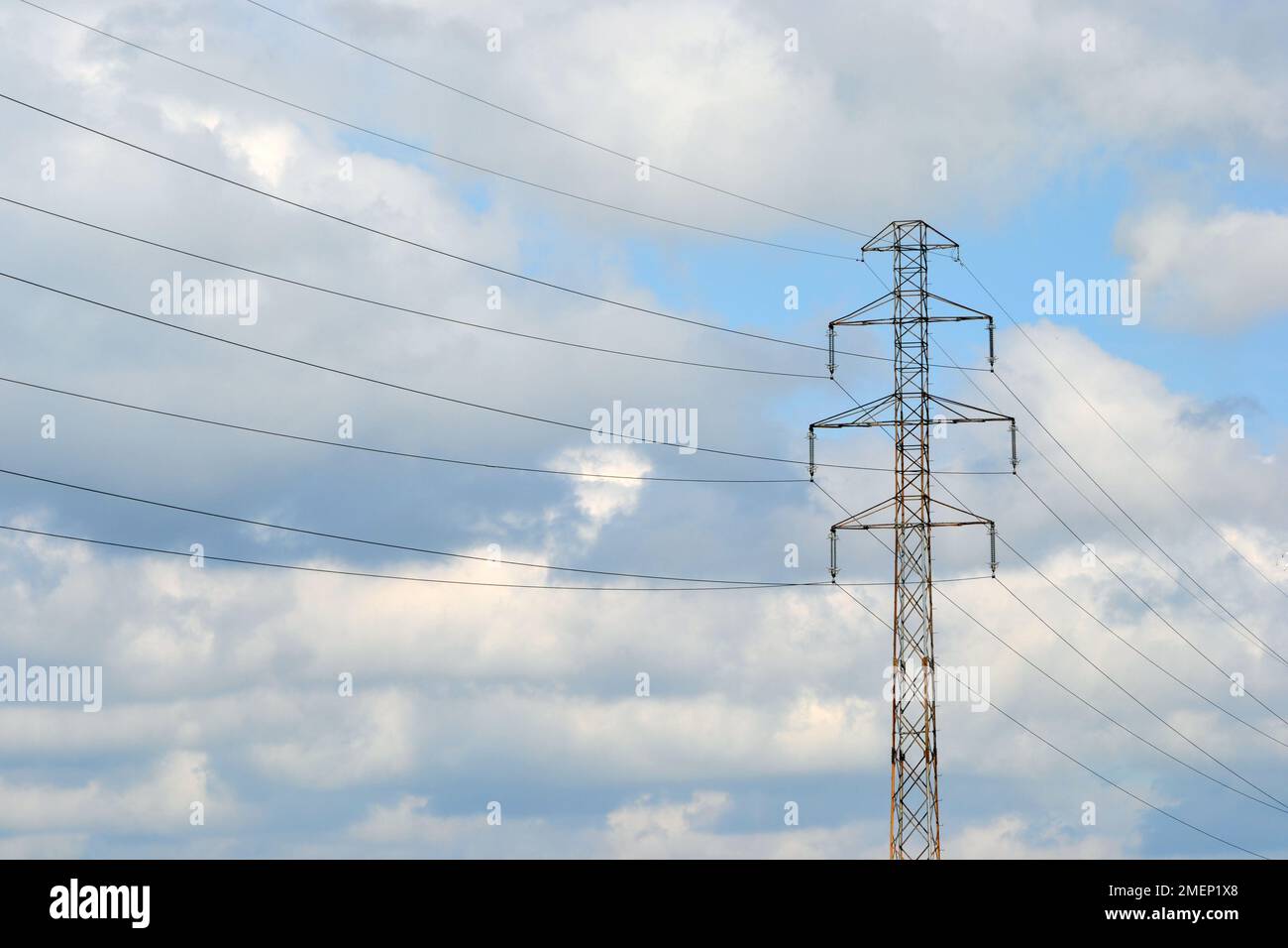 Electricity pylon and sky with clouds Stock Photo - Alamy