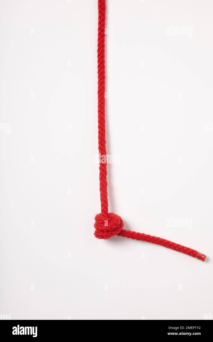 Sink Stopper Knot, tied in red rope Stock Photo