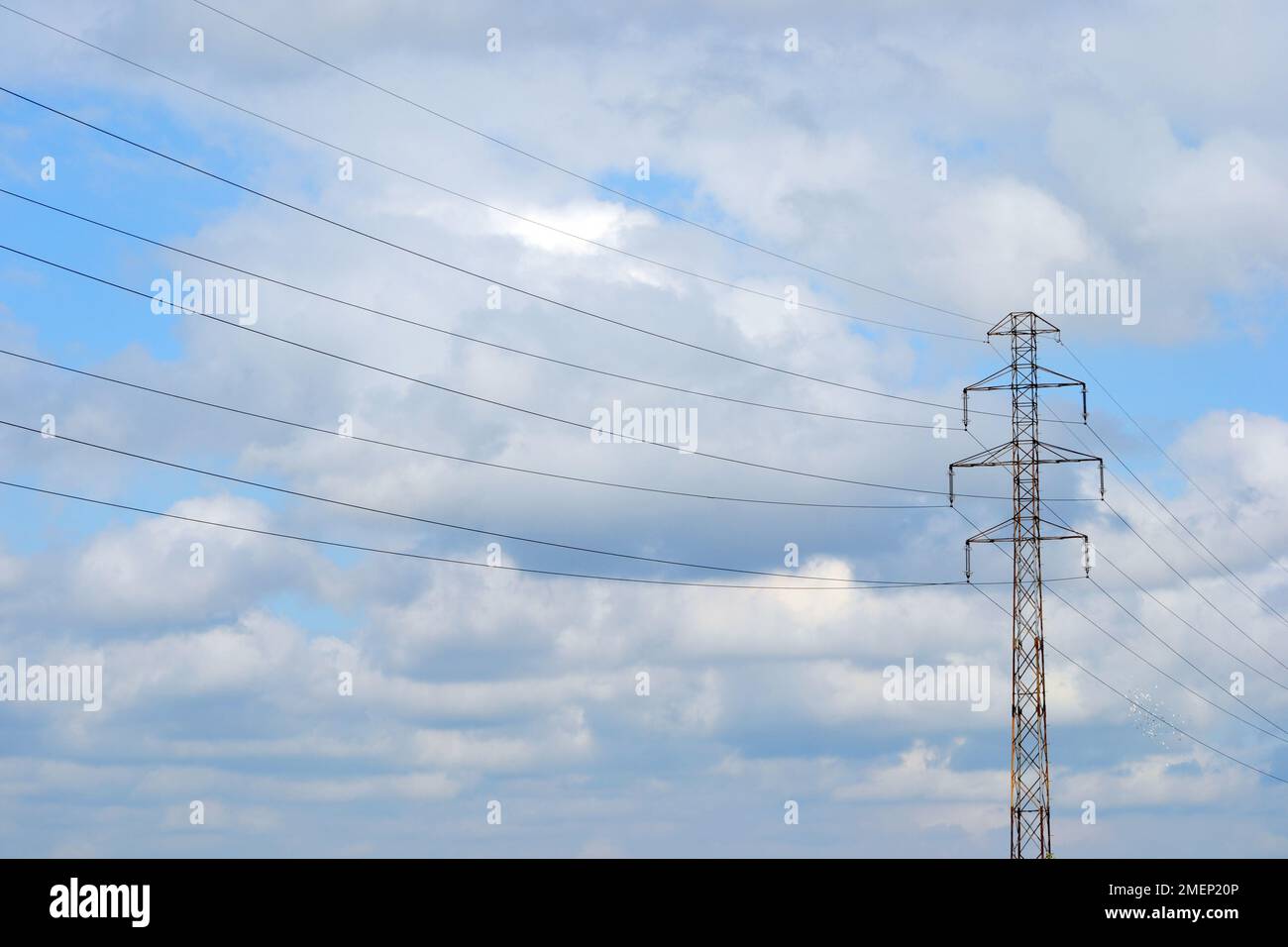Electricity pylon and sky with clouds Stock Photo - Alamy