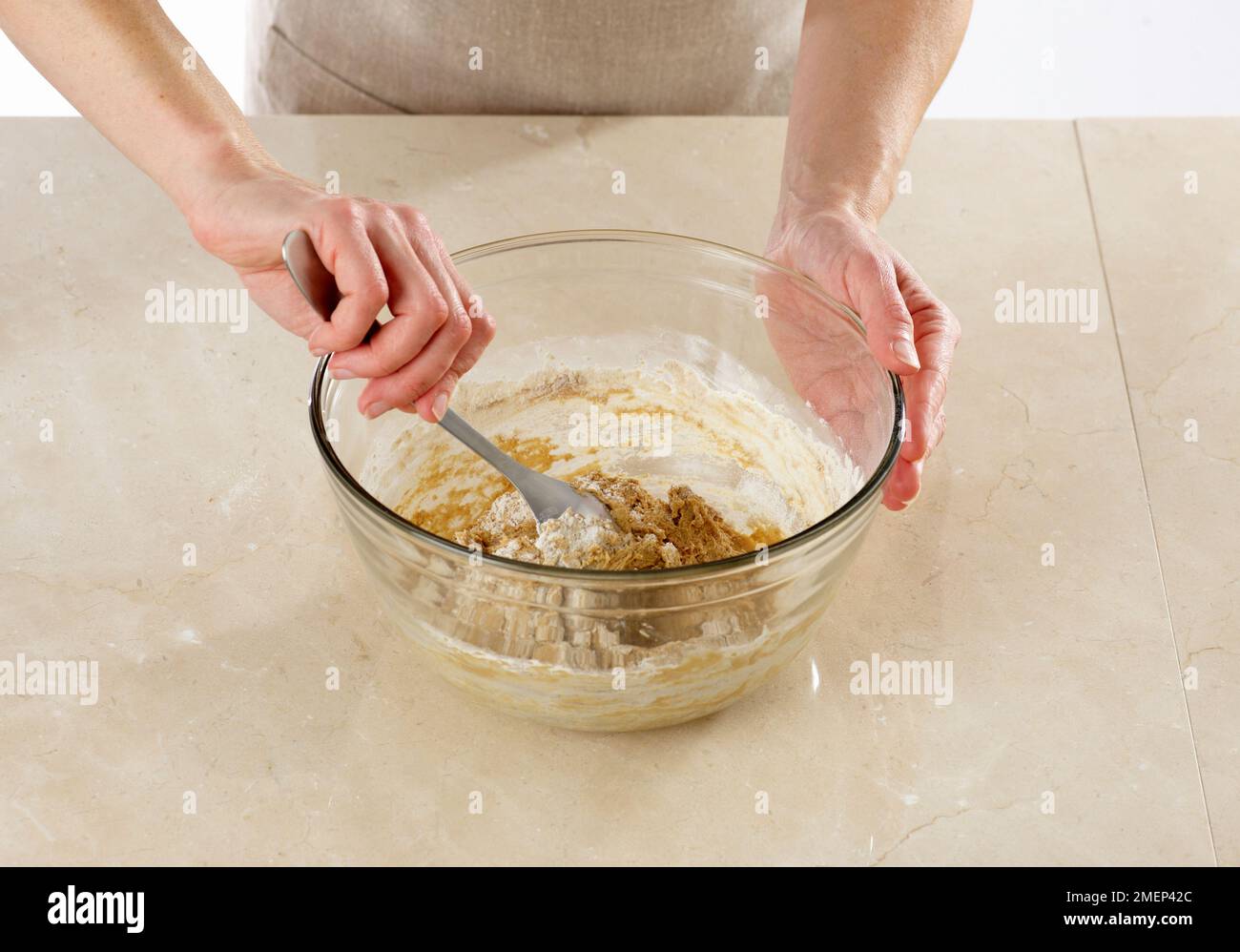Making Rhubarb and Ginger Upside Down Cake, folding dry ingredients