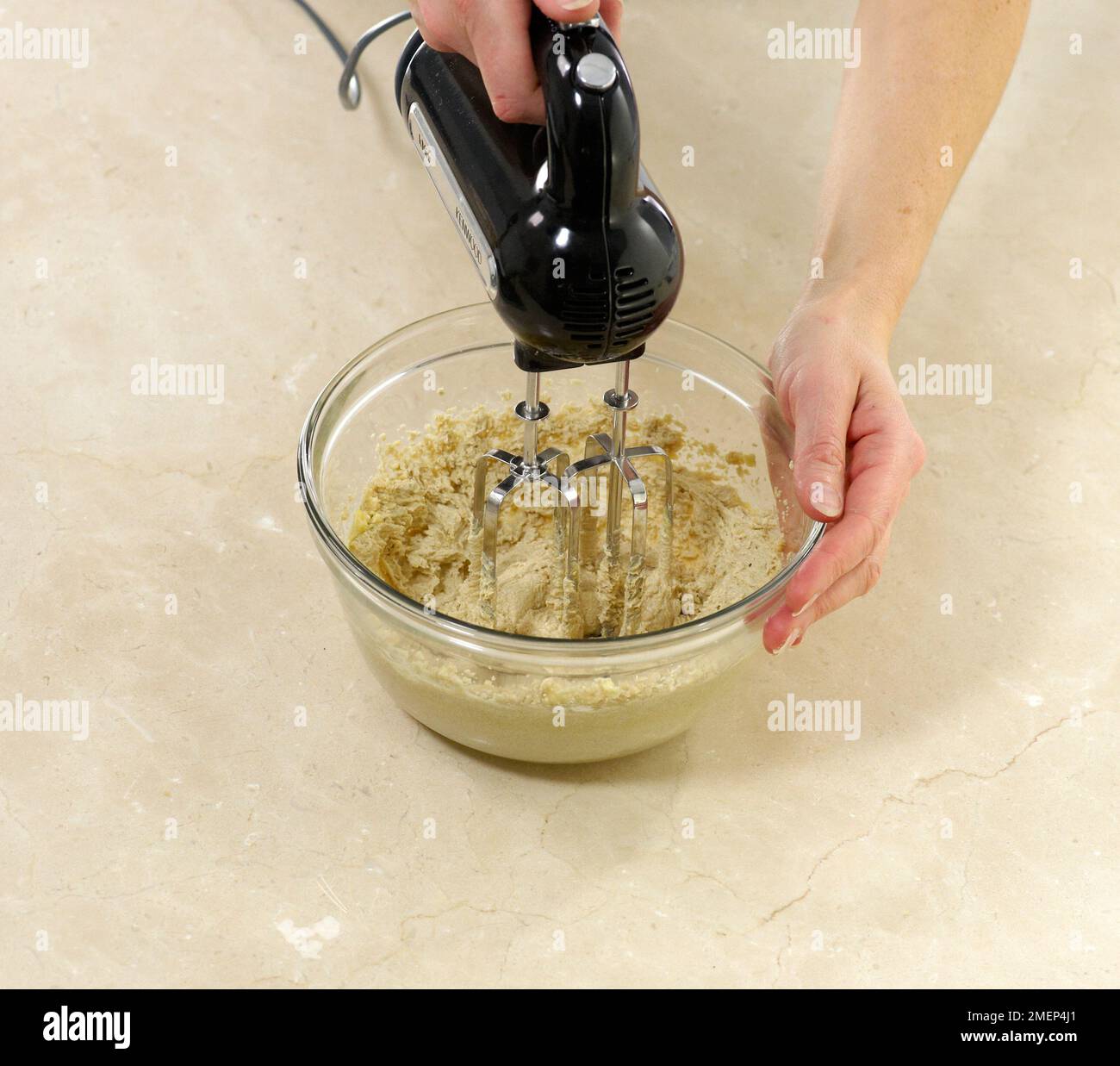 Making Whoopie Pies, creaming together butter and brown sugar Stock Photo Alamy