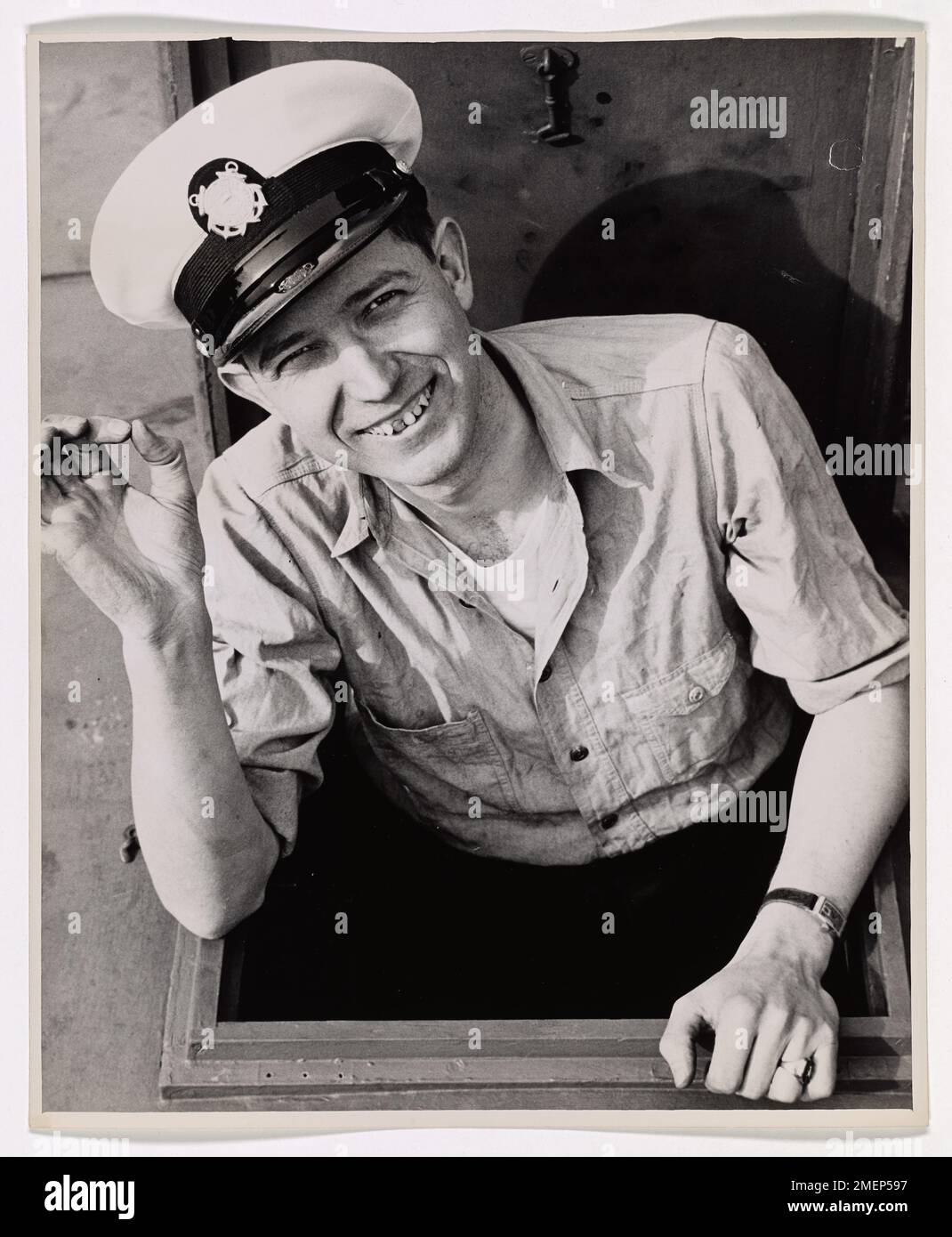 Photograph of Percy D. Coolman Giving the OK Sign from the Engine Room