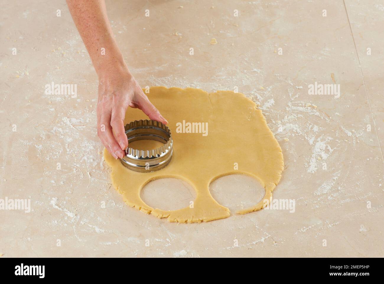 Making Butter Biscuits, cutting out round biscuits with pastry cutter Stock Photo Alamy
