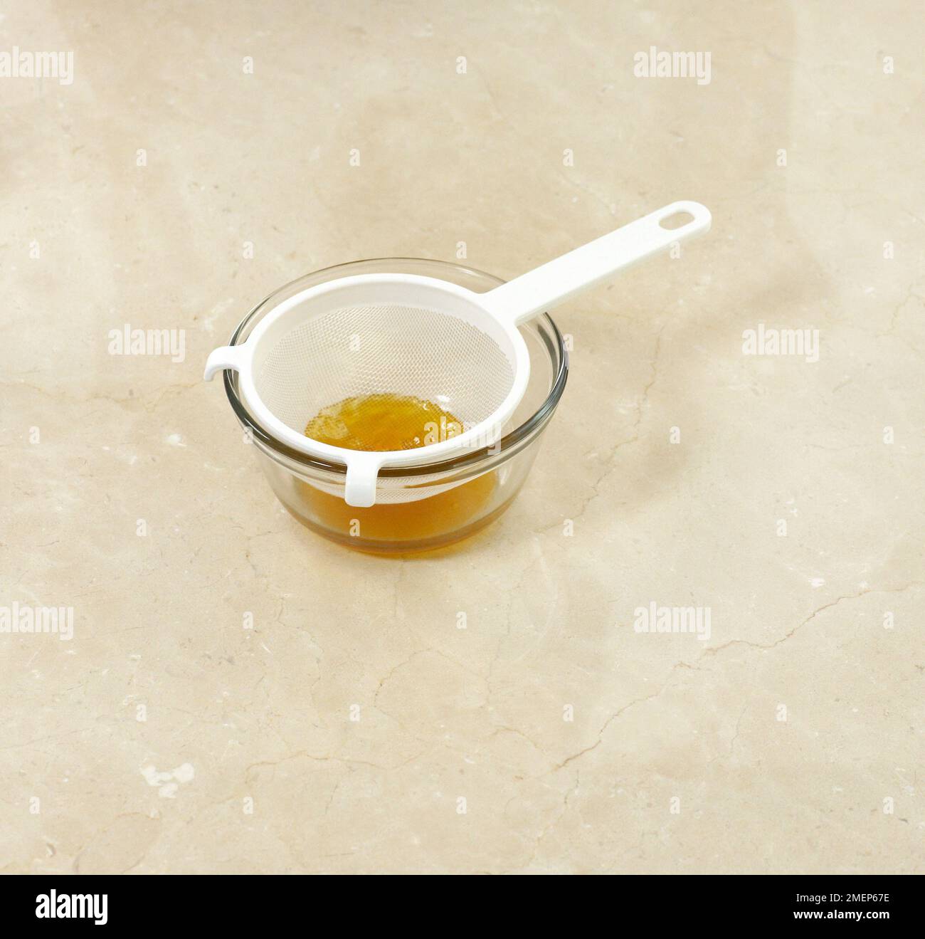 Normandy Pear Tart, making glaze for tart by melting apricot jam with