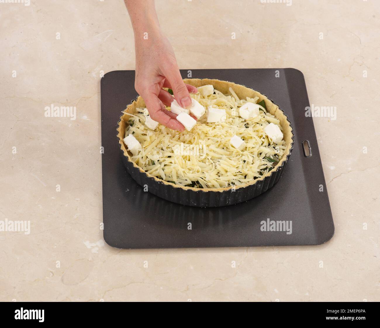 Swiss Chard and Gruyere Tart, adding grated gruyere cheese and