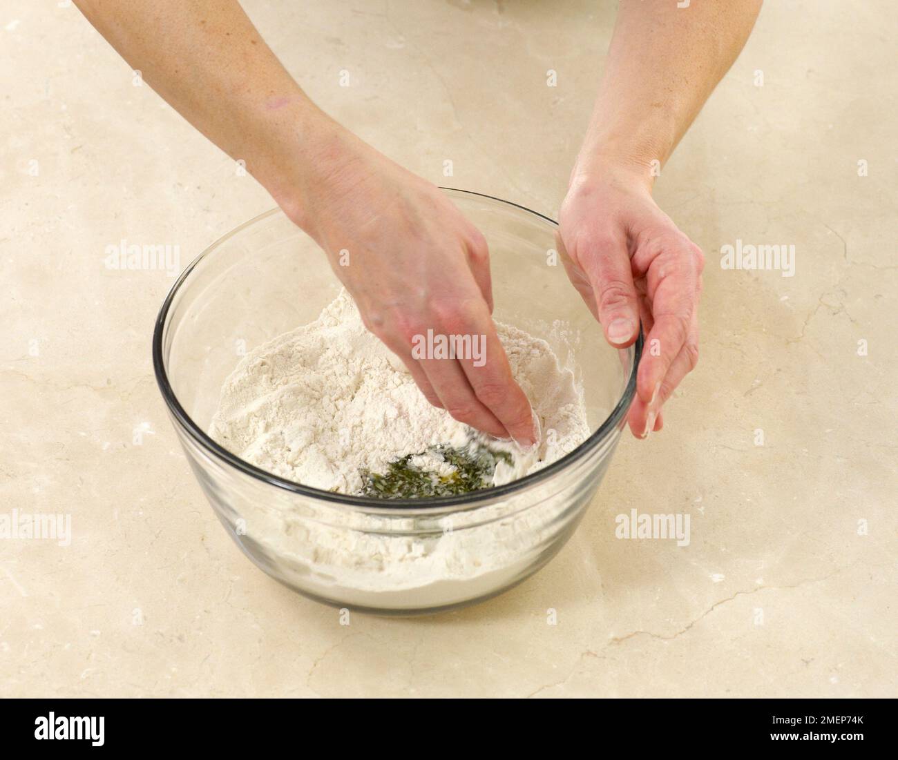 Rosemary Focaccia, mixing ingredients together Stock Photo Alamy