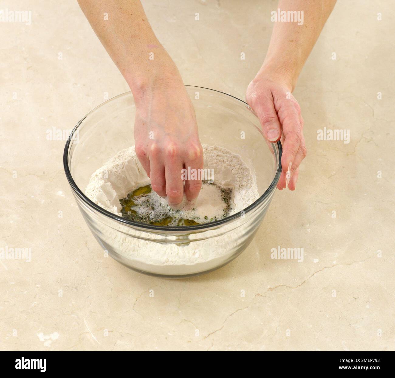 Rosemary Focaccia, mixing ingredients together Stock Photo Alamy