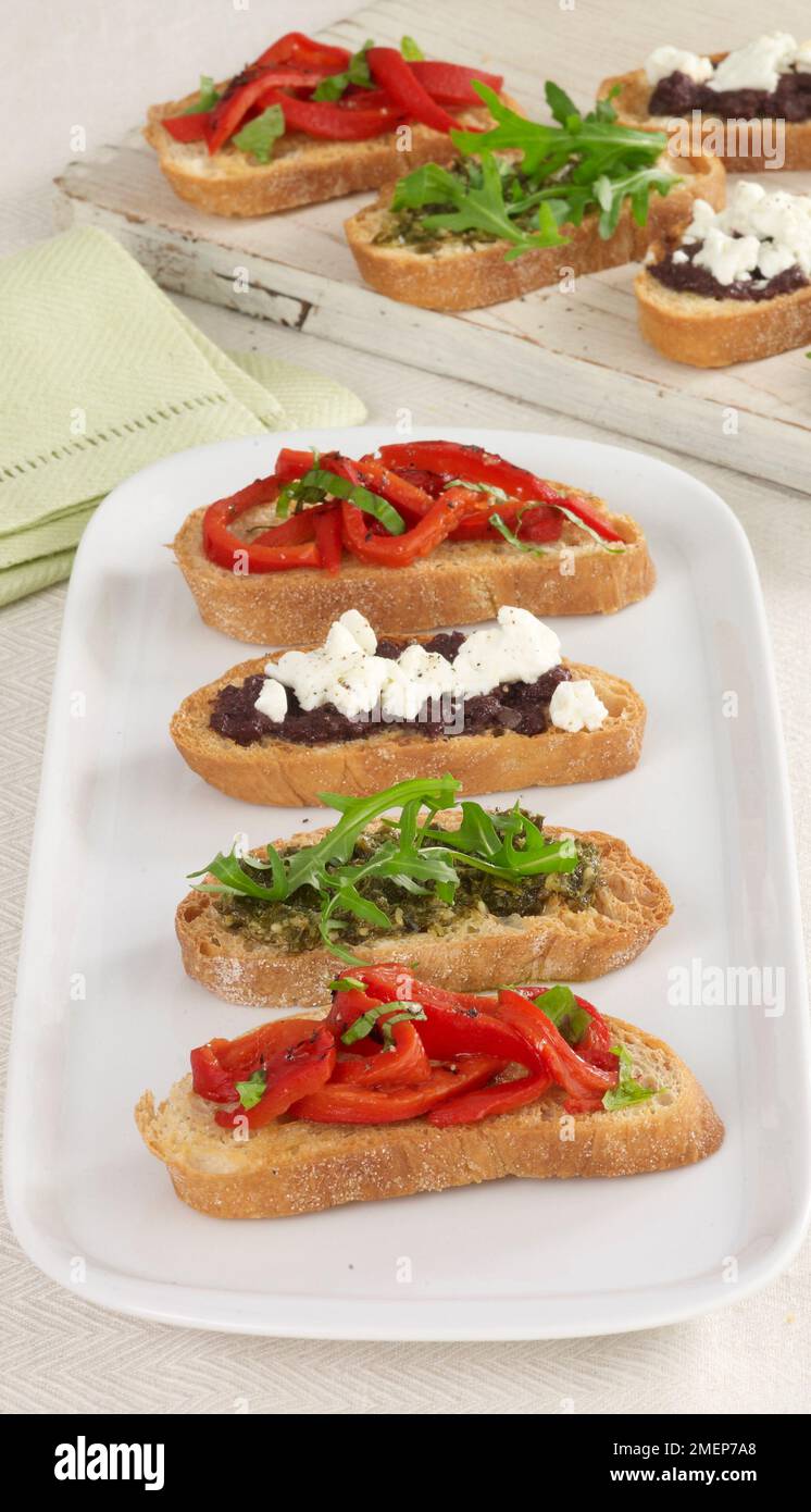 Ciabatta Crostini, topped with rocket pesto, red peppers and olive
