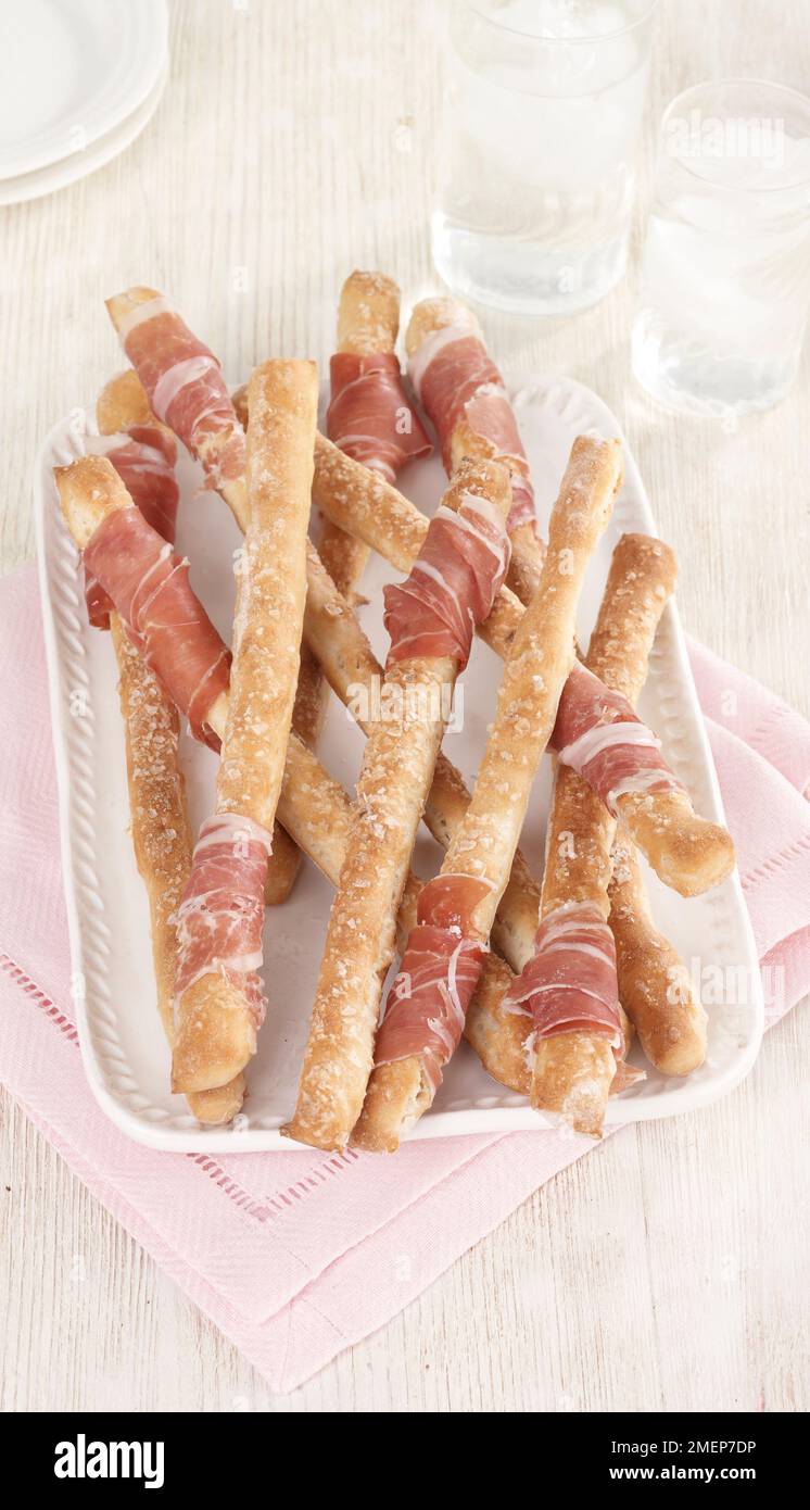Grissini wrapped with parma ham, canapes Stock Photo Alamy