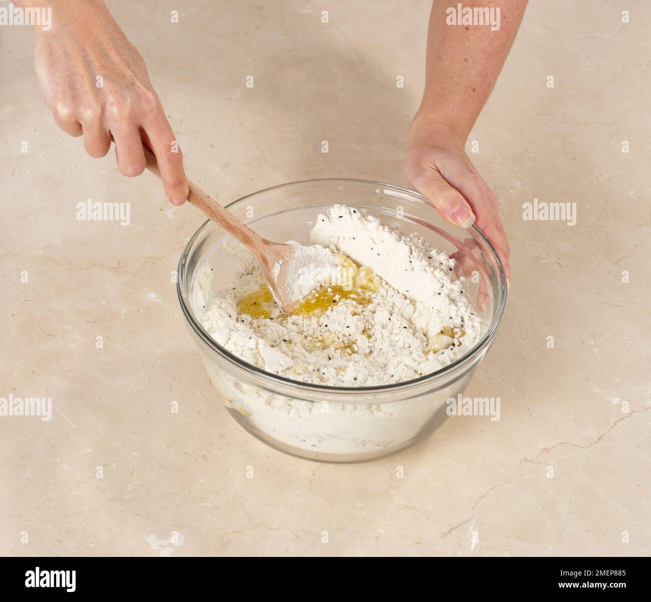 Making Naan Bread, mixing ingredients together, flour, butter, nigella