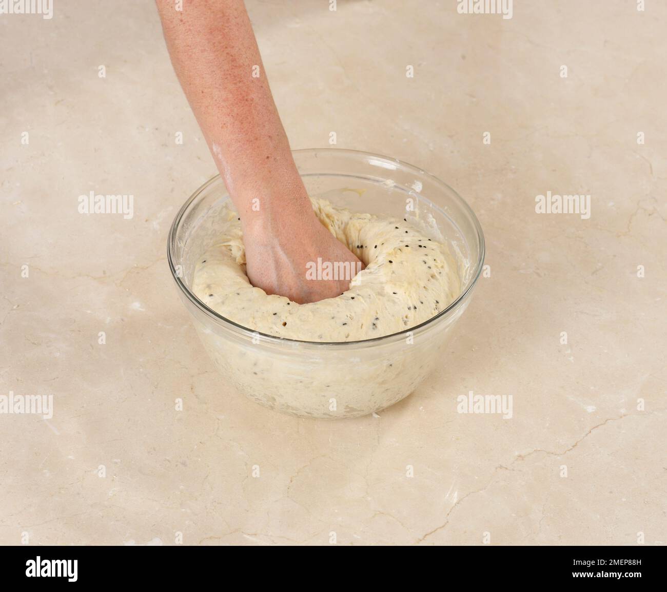 Making Naan Bread, knocking back the risen dough Stock Photo Alamy