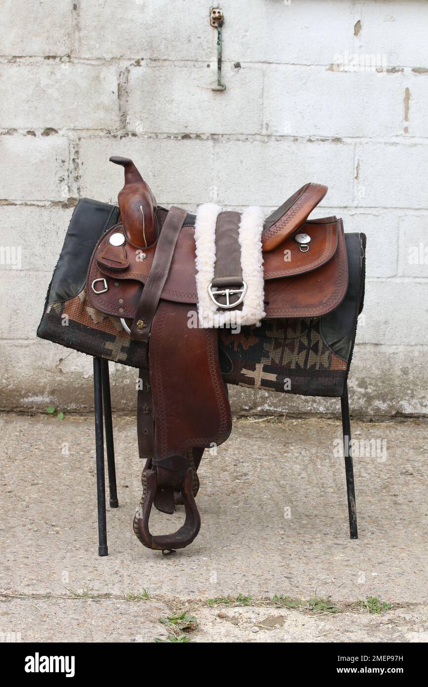 American western saddle on saddle rack Stock Photo