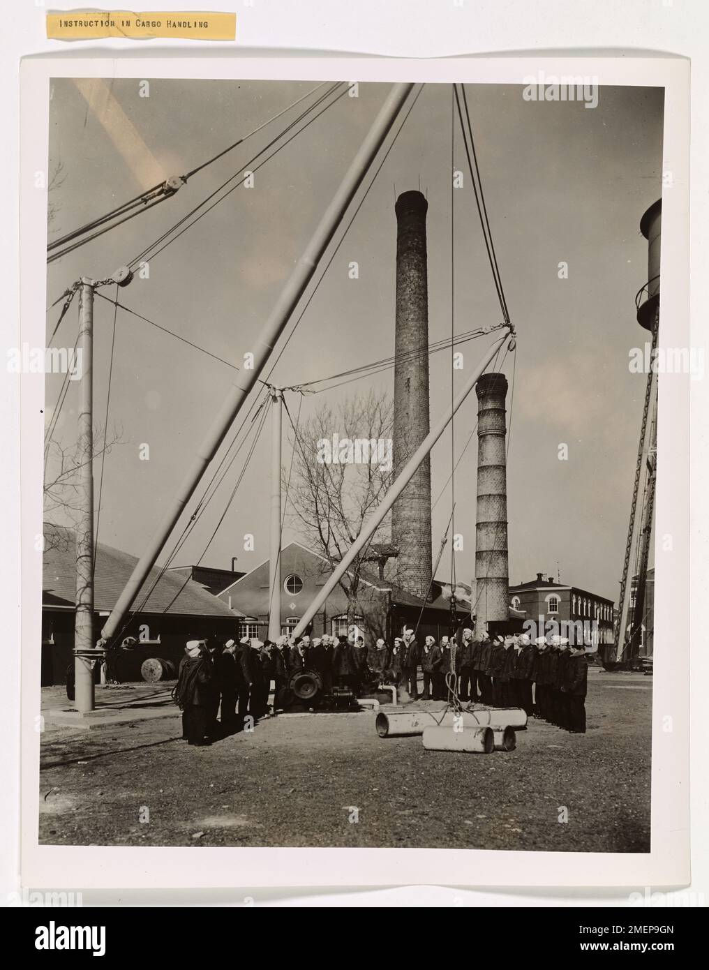 U.S. Coast Guardsmen receive training in cargo handling aboard a vessel at Hoffman Island, New York Harbor. The training focuses on efficient and safe methods of loading and unloading critical supplies during wartime operations in support of Allied forces. Stock Photo