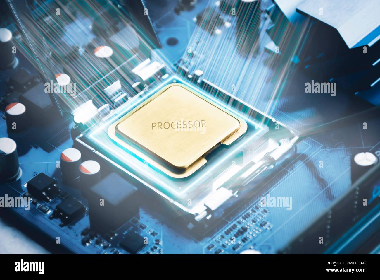 Golden CPU chip in a slot on a computer motherboard and glowing light around the processor chip, computer technology parts concept Stock Photo