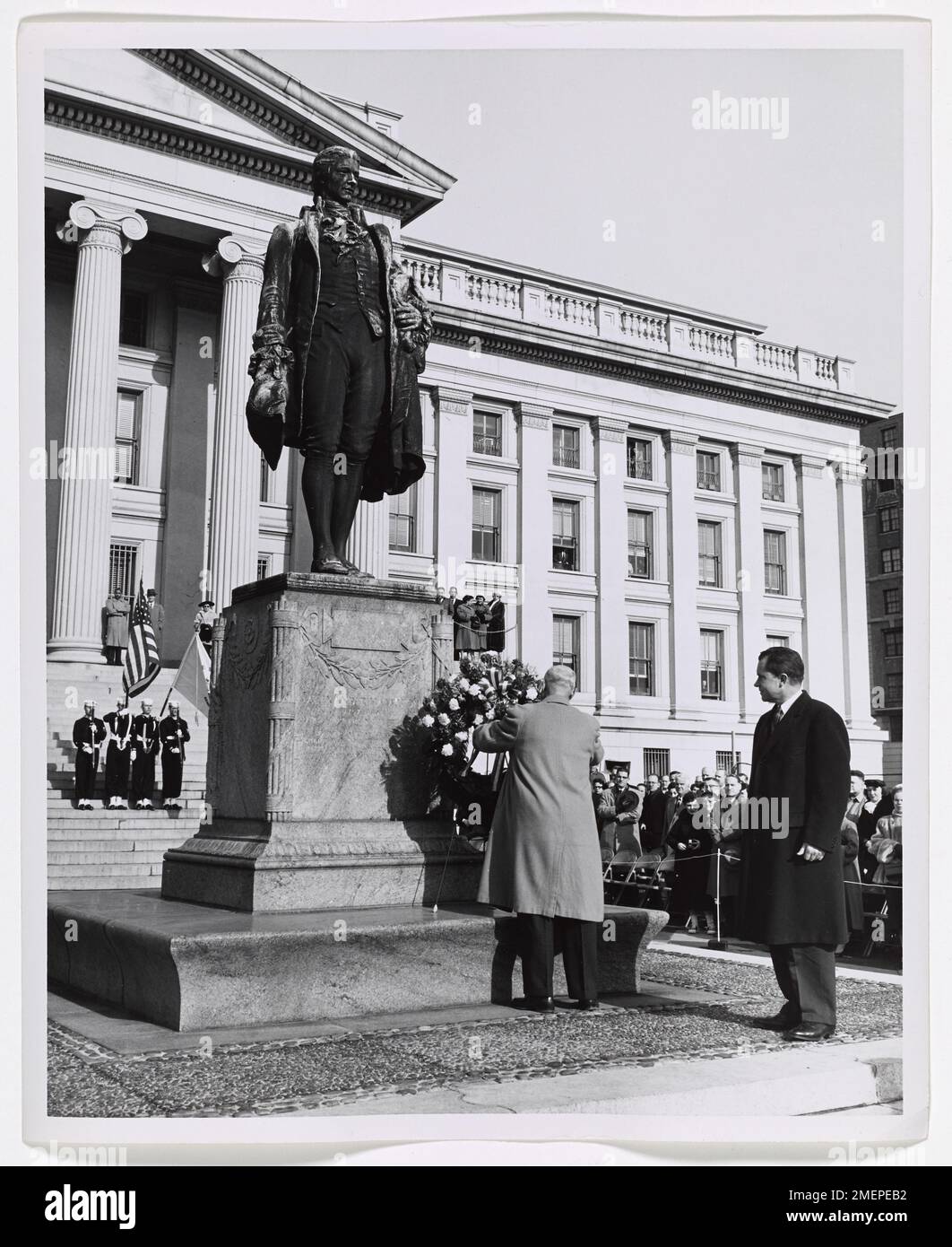 Opening Day of Alexander Hamilton Bicentennial in Washington, DC. Picture shows George M. Humphrey arranging wreath in front of Alexander Hamilton statue as Richard Nixon looks on. Stock Photo