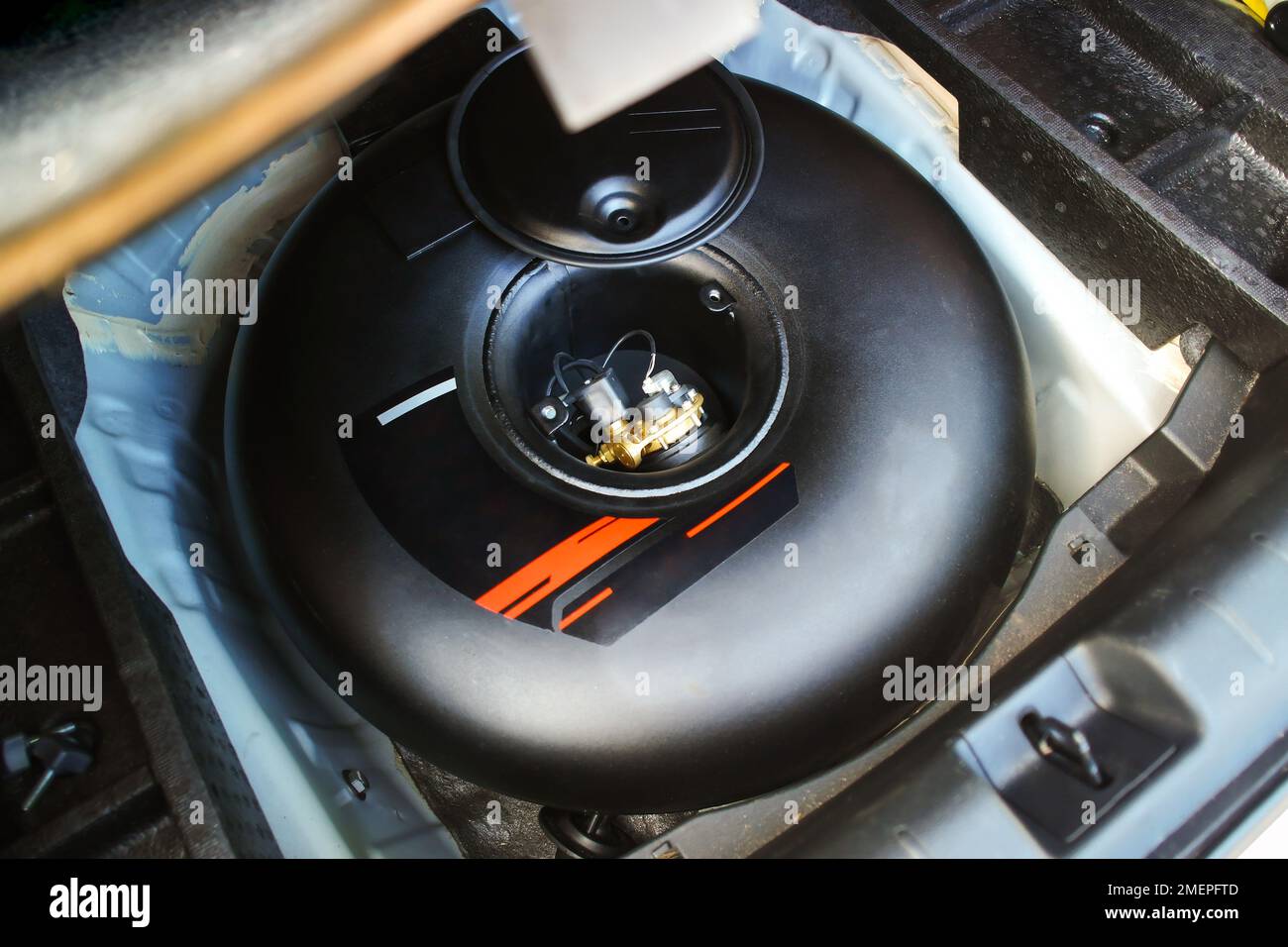 Propane or LPG black container with circle shape in spare wheel holder