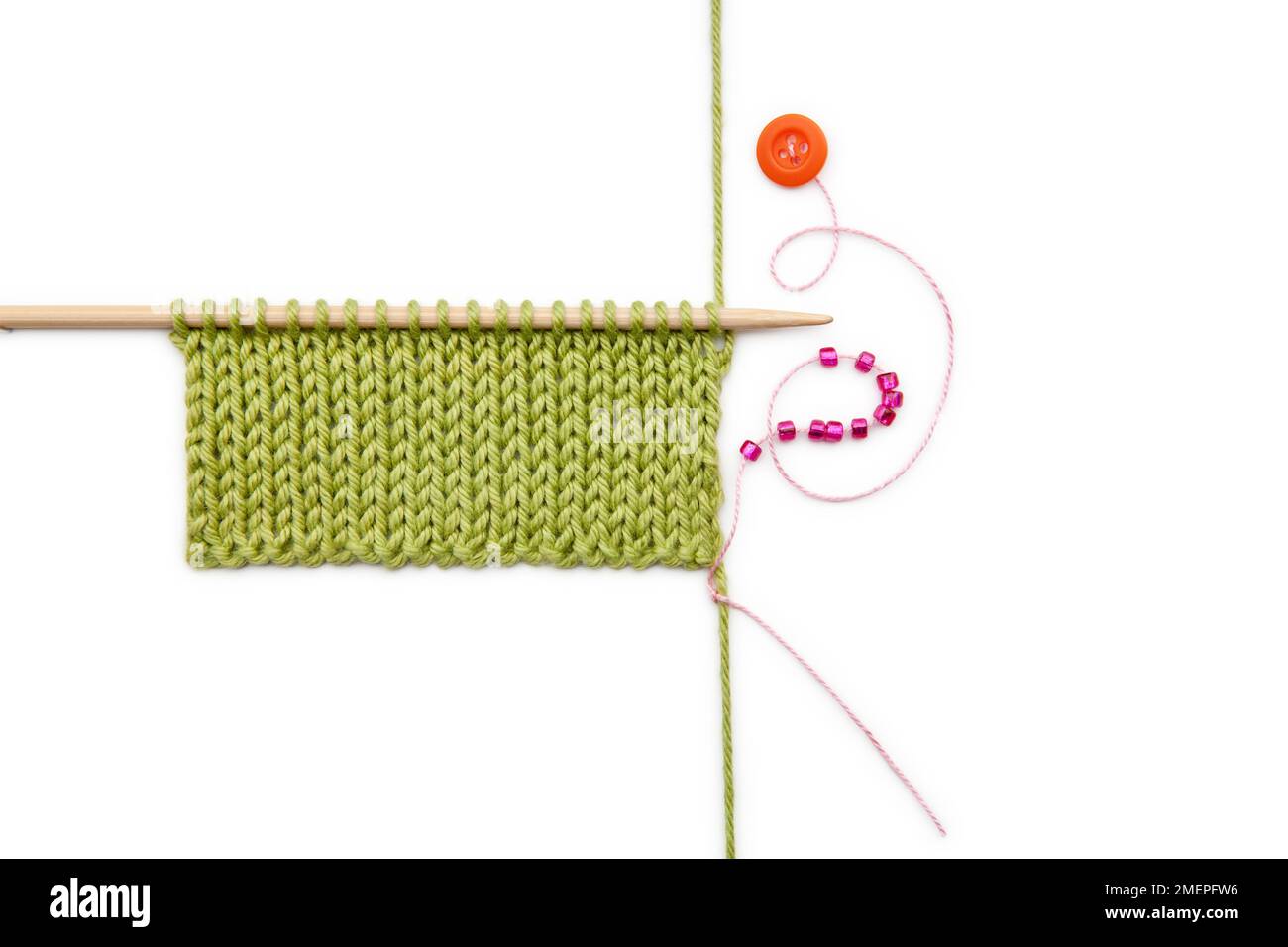 Using beads as stitch and row markers, knitting technique Stock Photo