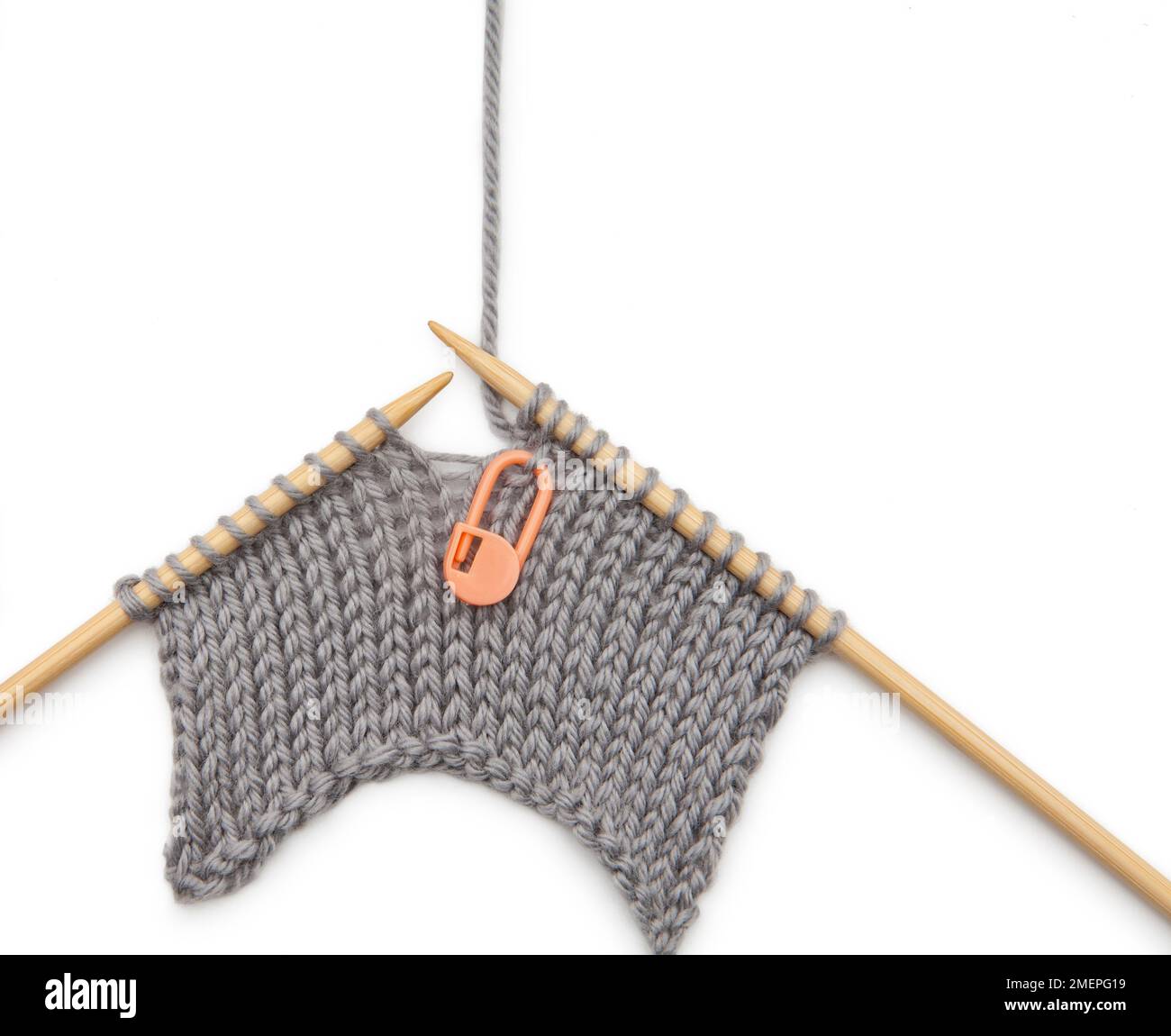 Knit into front and back as a paired central increase knitting