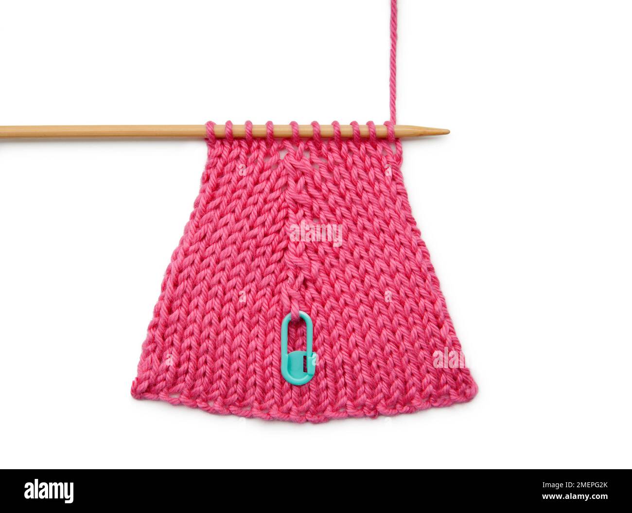 Raised central increase knitting technique using stitch holder, close