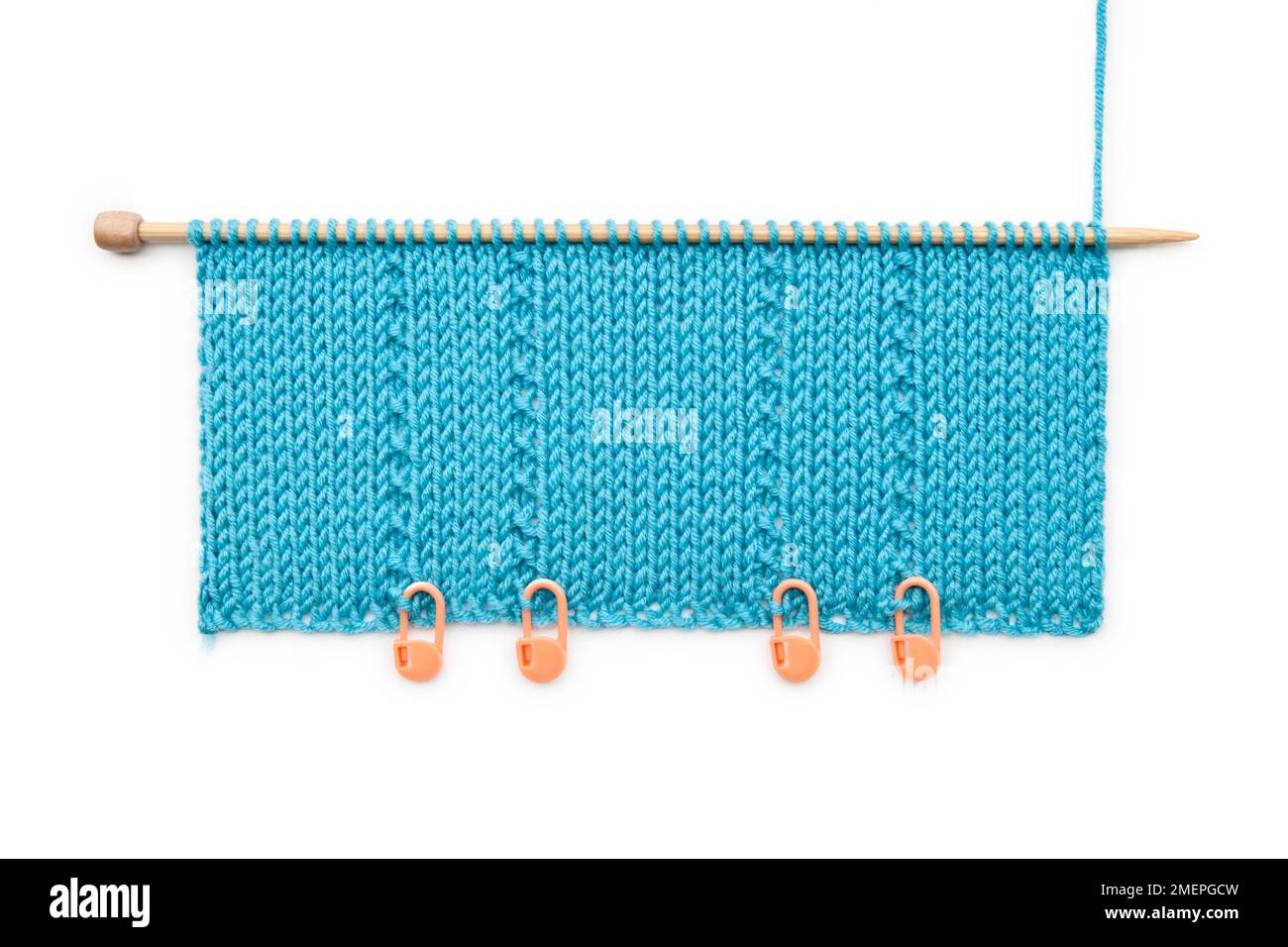 Example of knitting pleats technique using stitch holder Stock Photo