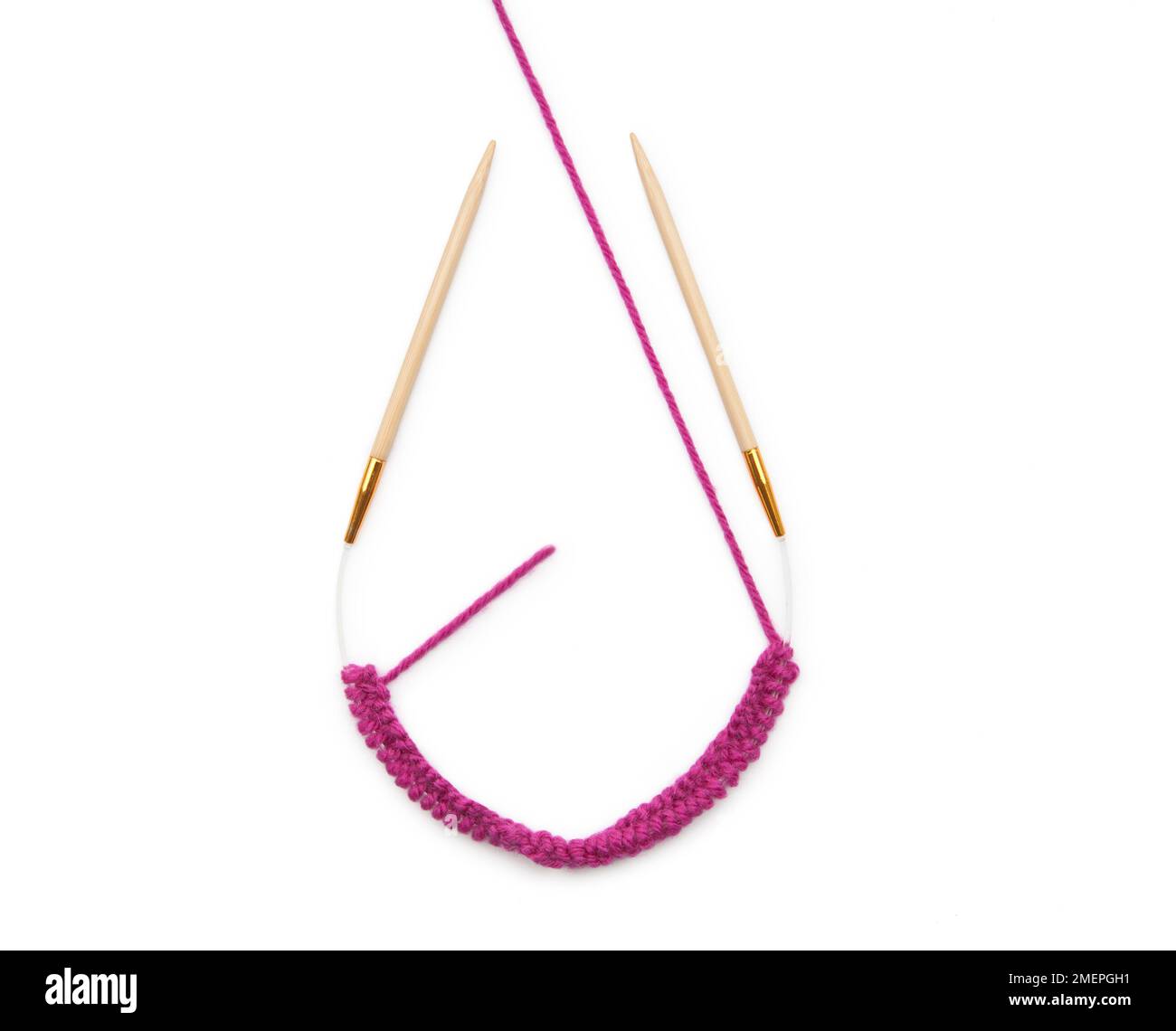 Example of working with a circular knitting needle - knitting a mobus loop Stock Photo