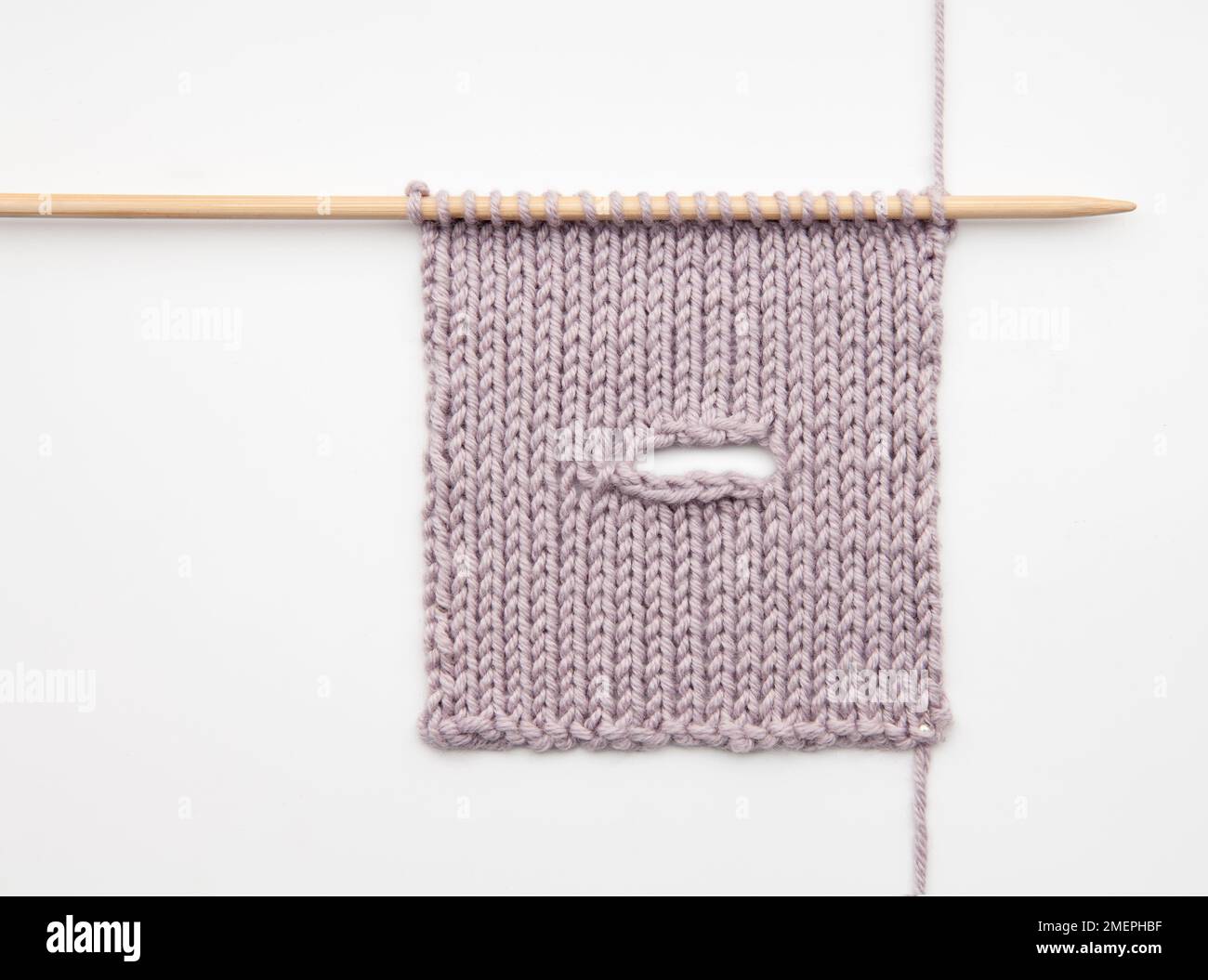 Example of increased horizontal buttonhole knitting technique Stock