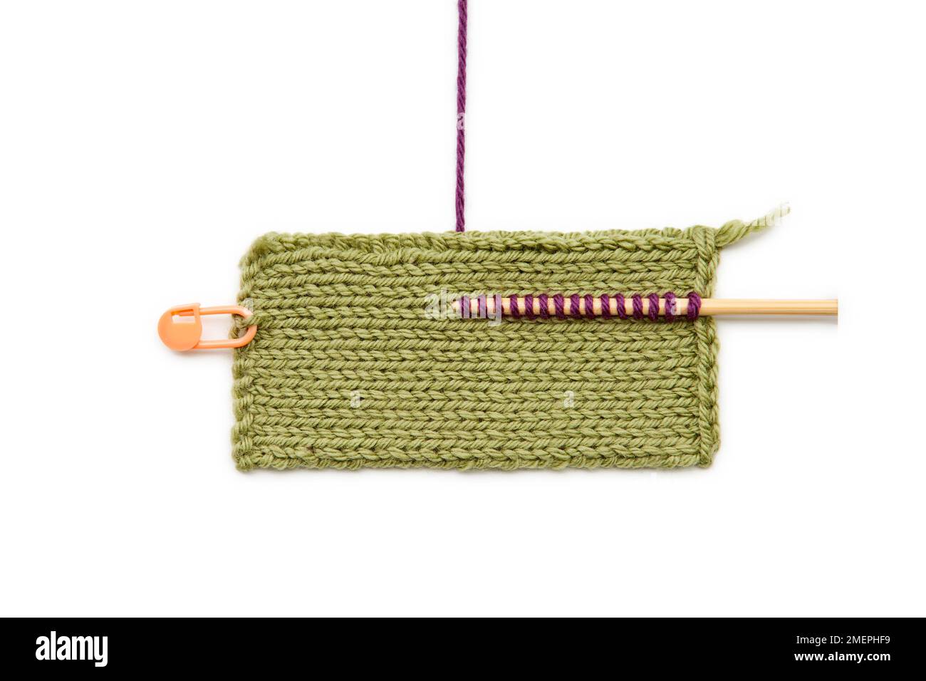 Top view of a large green knitting stitch holder isolated on a white  background Stock Photo - Alamy