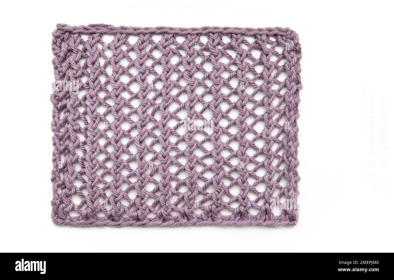 Interwoven eyelets pattern knitting sample Stock Photo