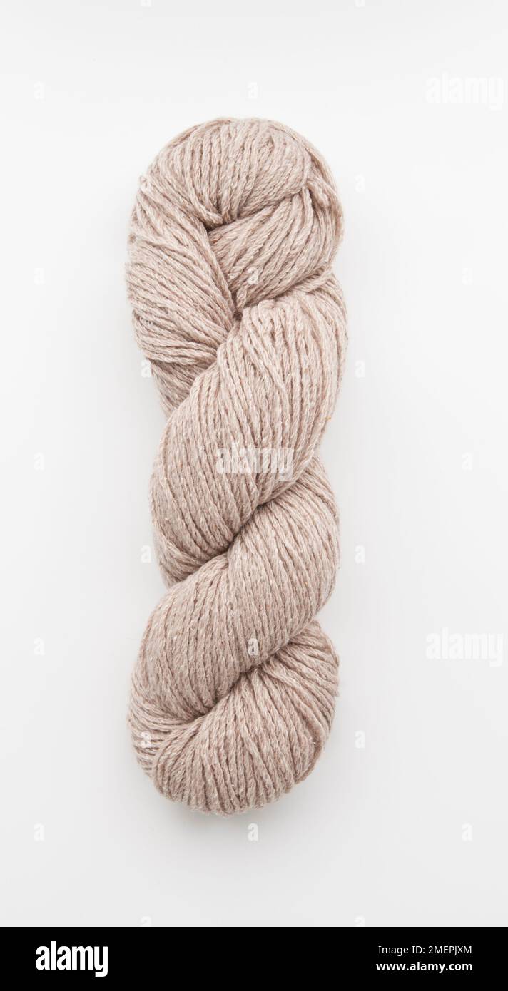 Twist of beige silky tweed yarn Stock Photo