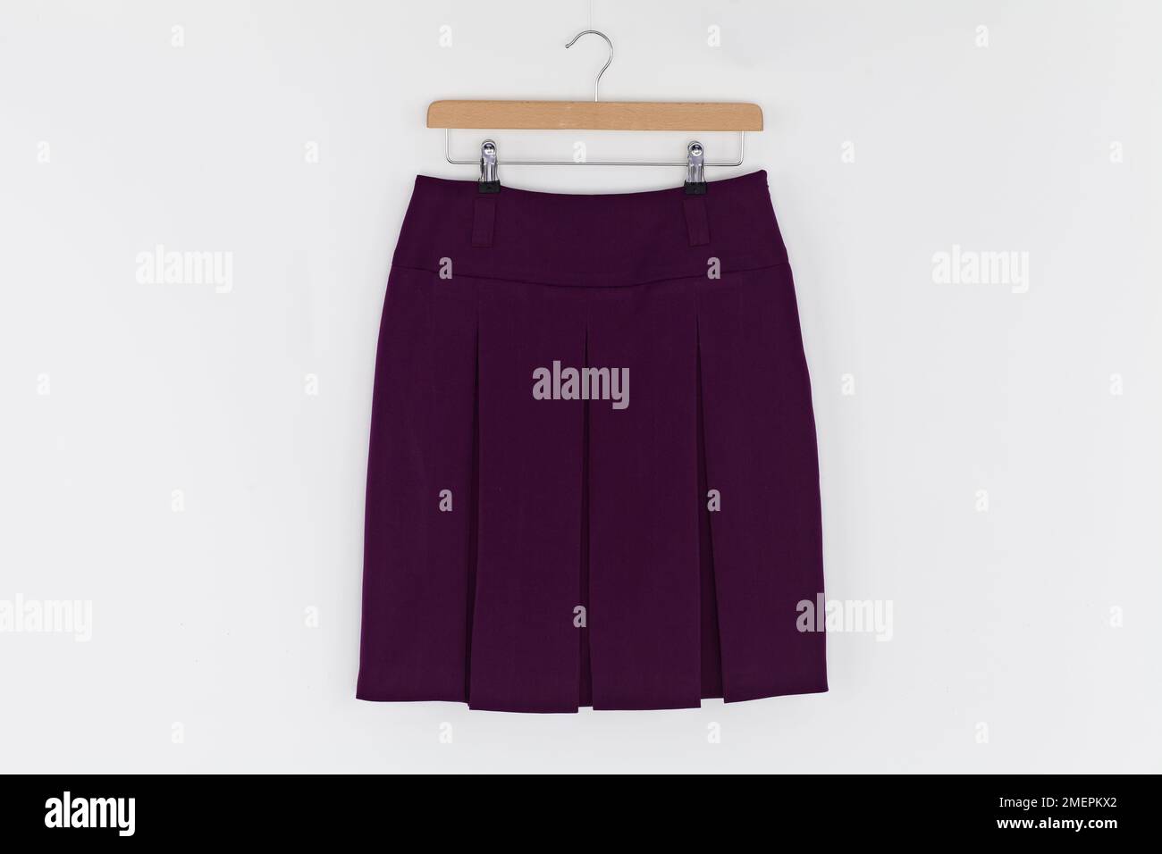 Classic pleated skirt on hanger, close up Stock Photo