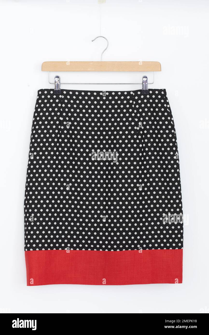 Simple a-line skirt on hanger lengthened with contrast band Stock Photo