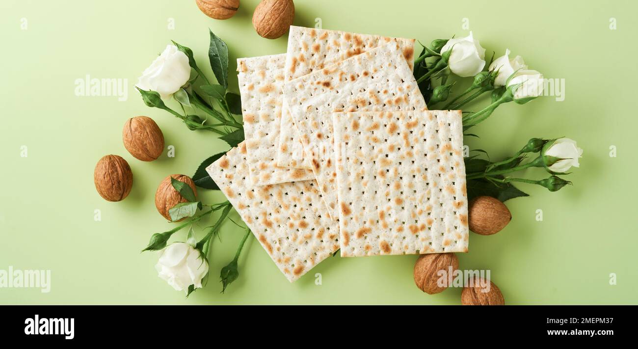 Passover celebration concept. Matzah, red kosher wine, walnut and