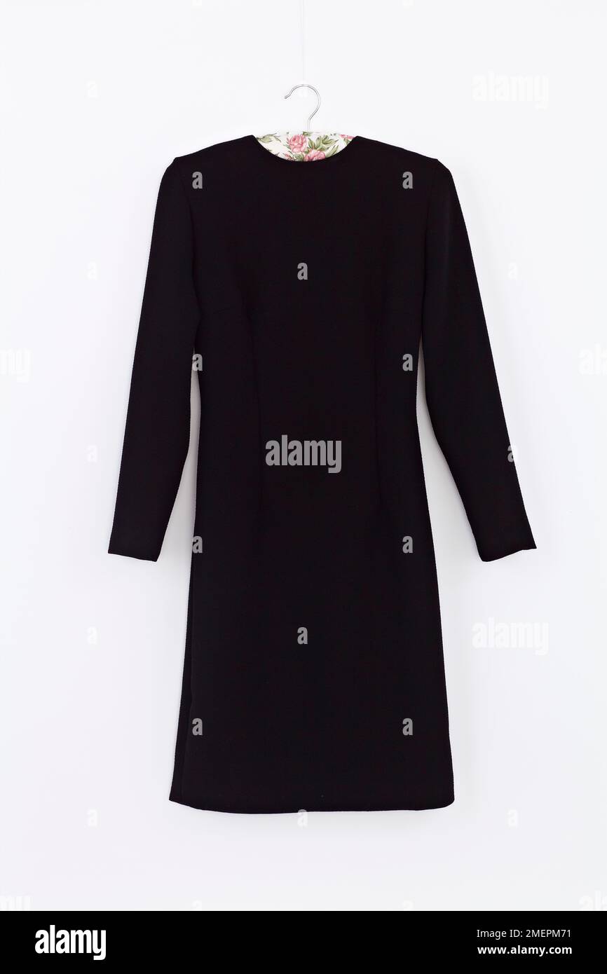 Black classic shift dress on hanger, close up Stock Photo