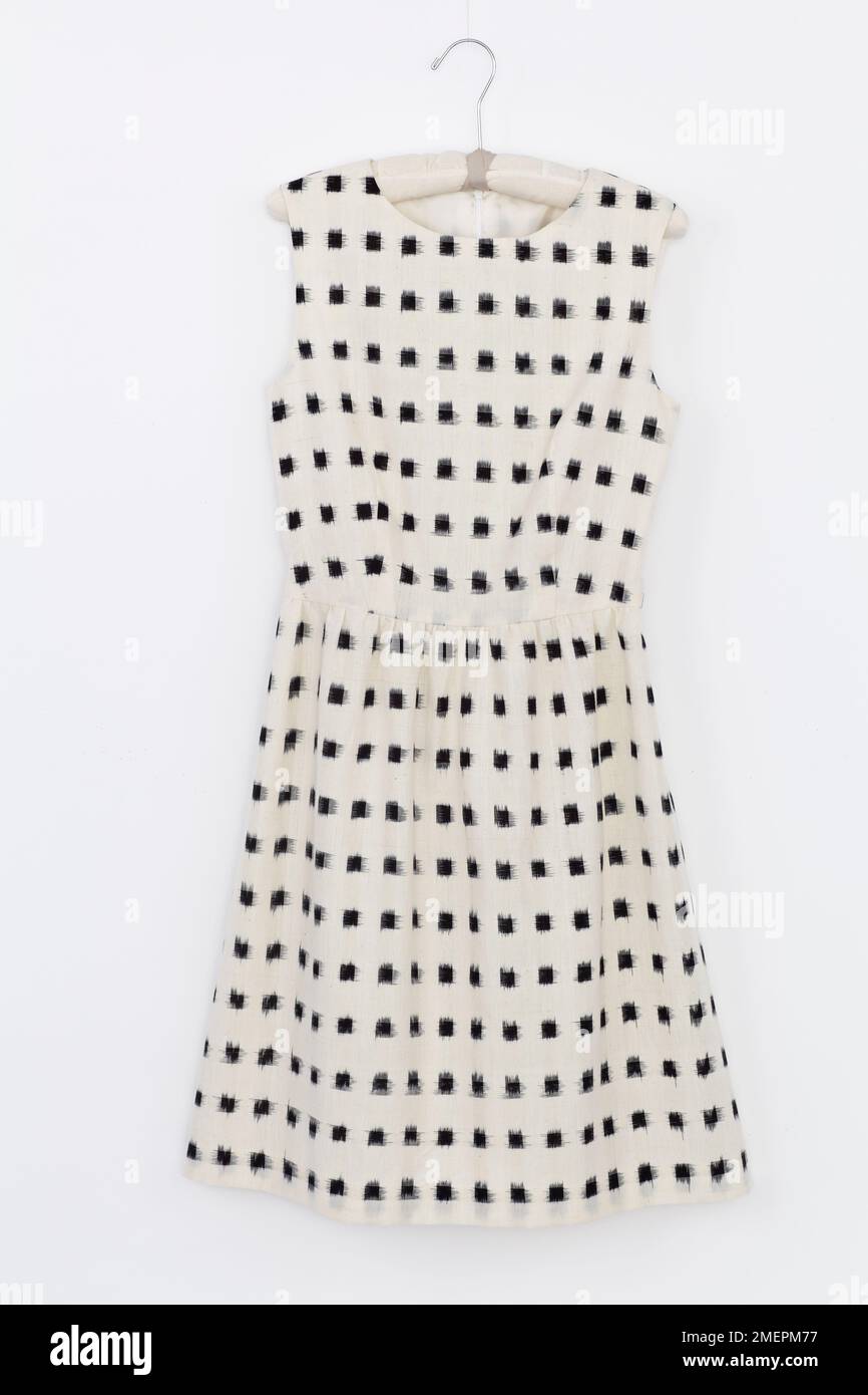 Black square patterned sleeveless waisted dress on hanger Stock Photo