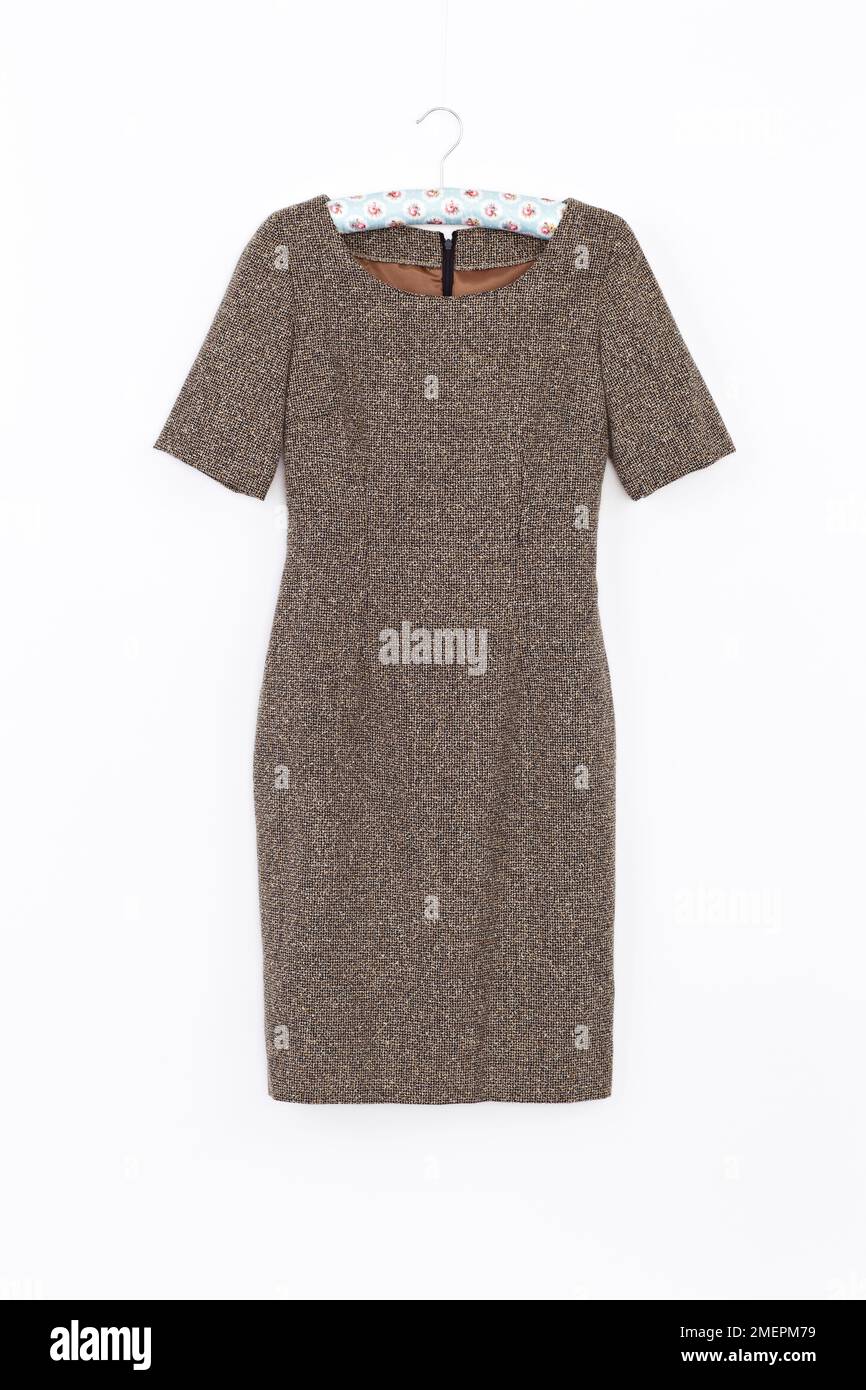Short-sleeved shift dress on hanger, close up Stock Photo