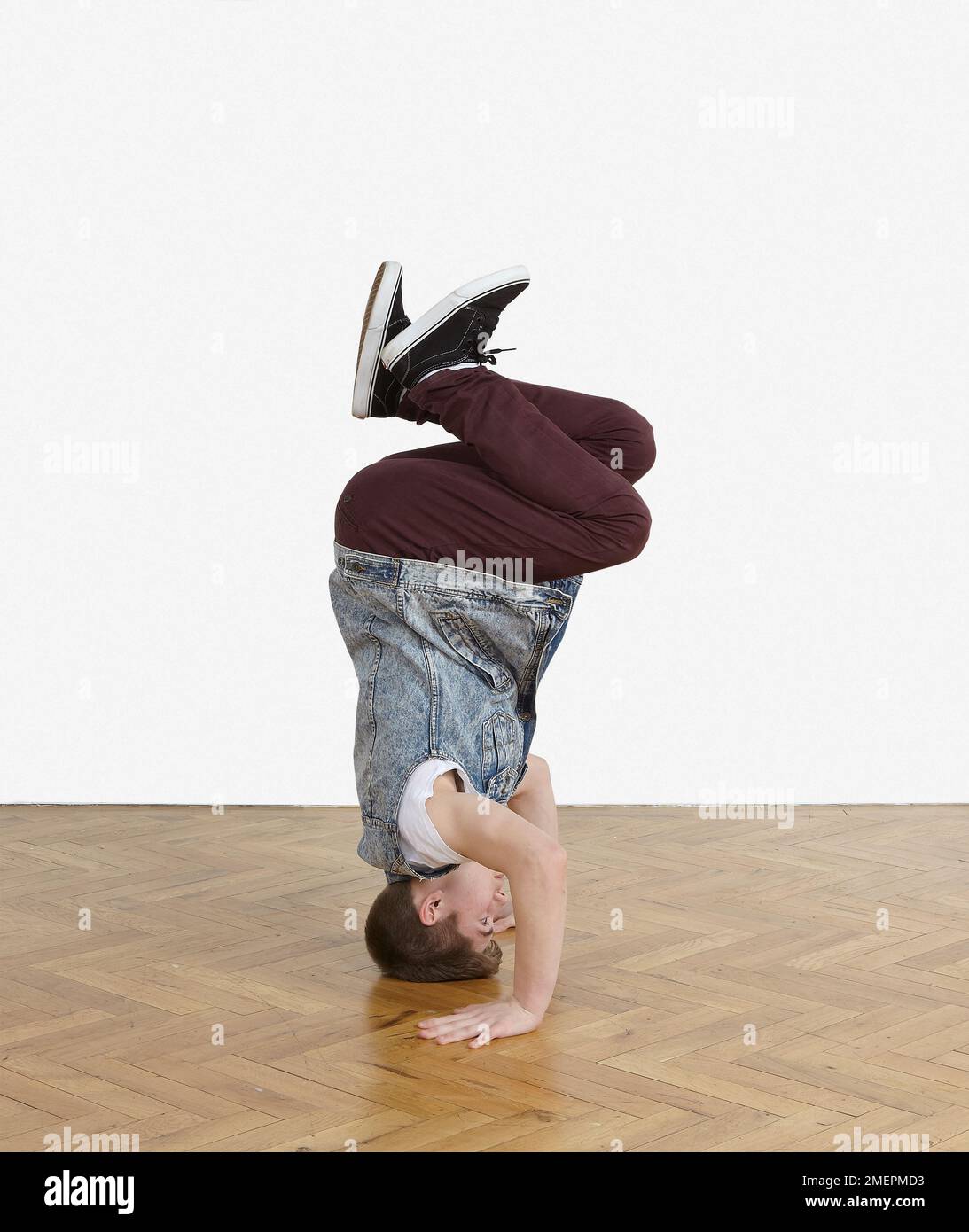 Teenager performing breakdance moves Stock Photo