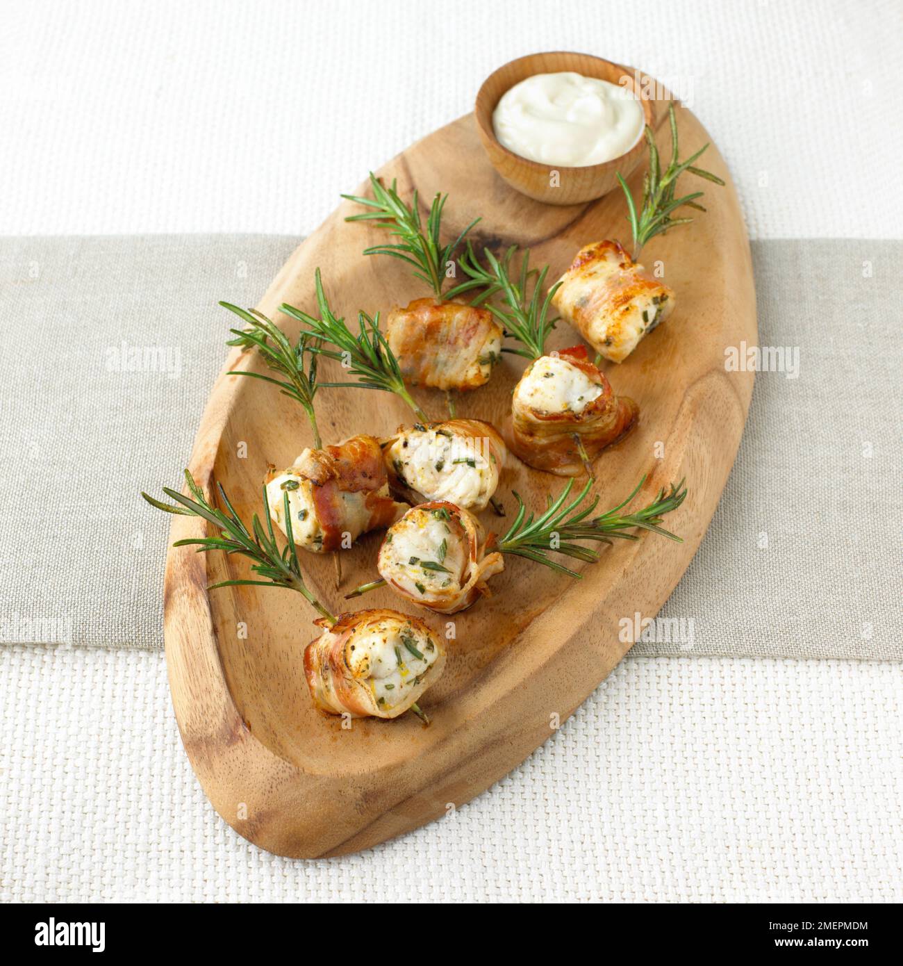 Monkfish, pancetta and rosemary spiedini with lemon aioli Stock Photo