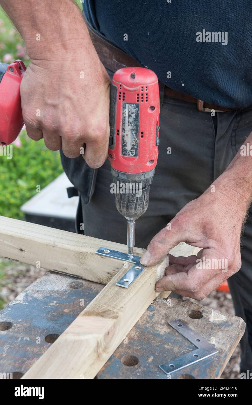 Creating wood frame with a drill Stock Photo Alamy