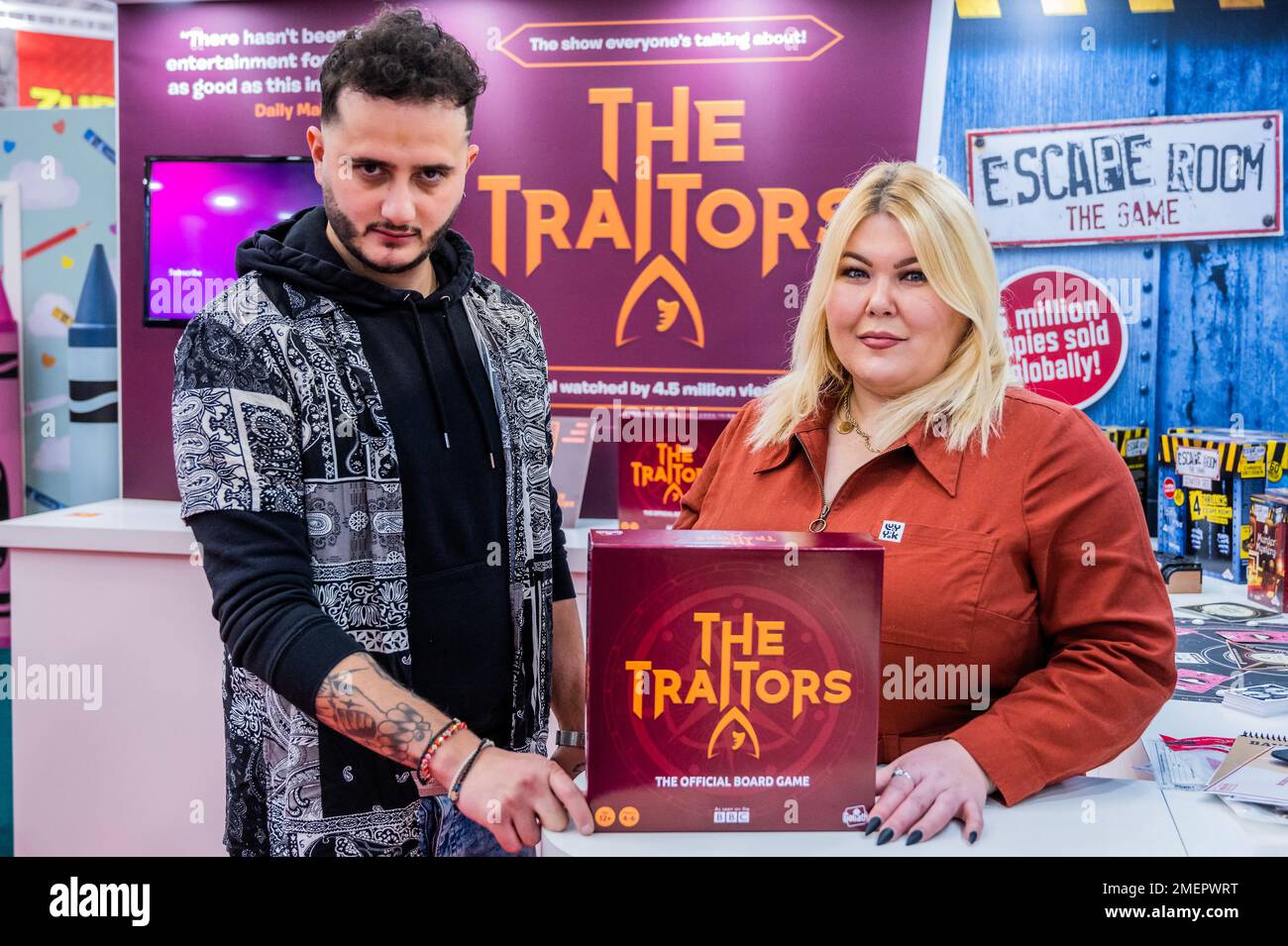 London, UK. 24th Jan, 2023. Wilfred Webster (the last surviving Traitor) and Hannah Byczkowski (the winner) launch The Traitors, a new board game, based on the recent BBC TV series, on the Vivi Goliath stand - The Toy Fair 2023 at Olympia. Credit: Guy Bell/Alamy Live News Stock Photo