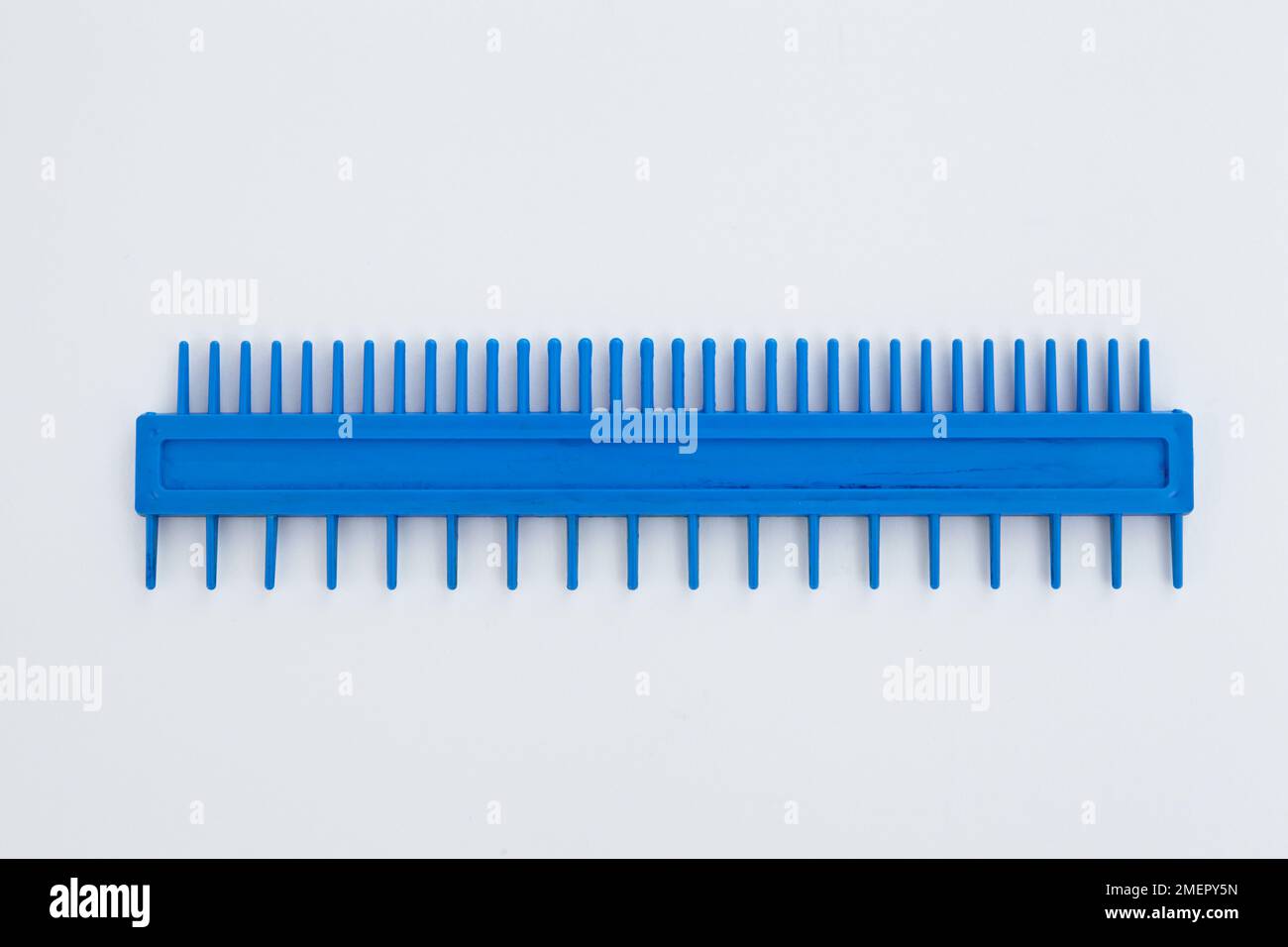 Blue plastic marbling comb Stock Photo