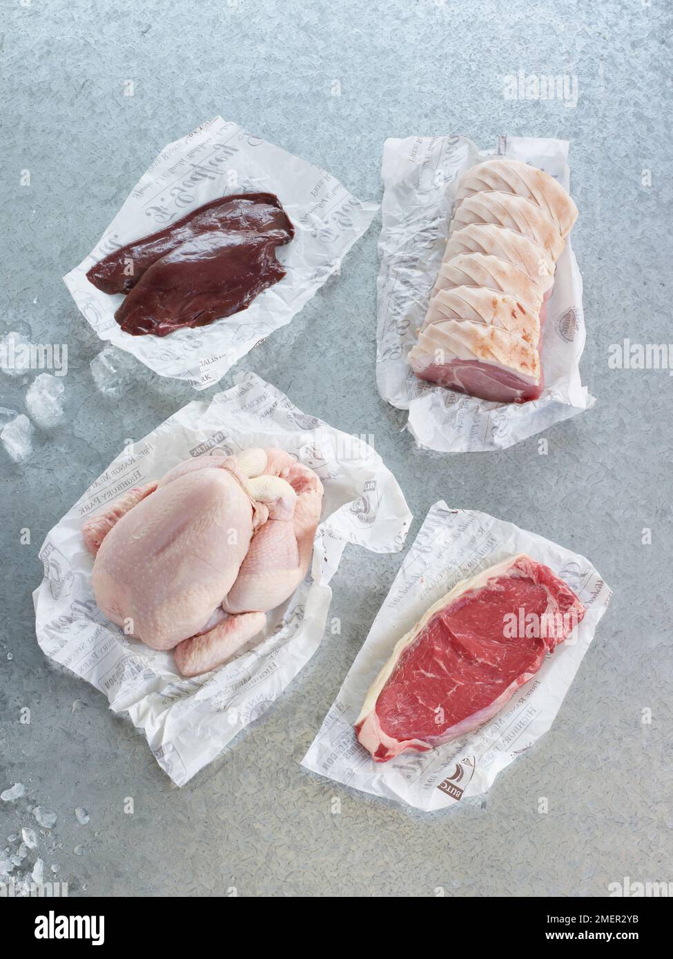 Lamb's liver, pork loin, whole chicken, and sirloin steak Stock Photo